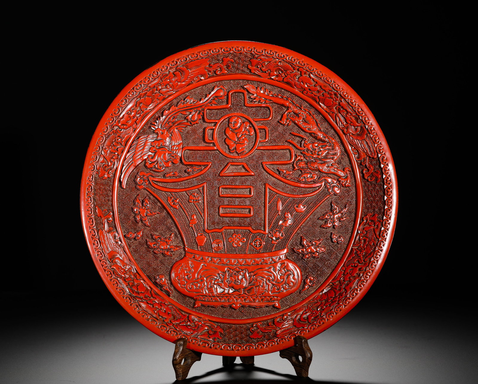 A LARGE PLATE WITH A DOUBLE HAPPINESS DRAGON AND PHOENIX PATTERN ENGRAVED BY EMPEROR QIANLONG OF THE (1 of 11)