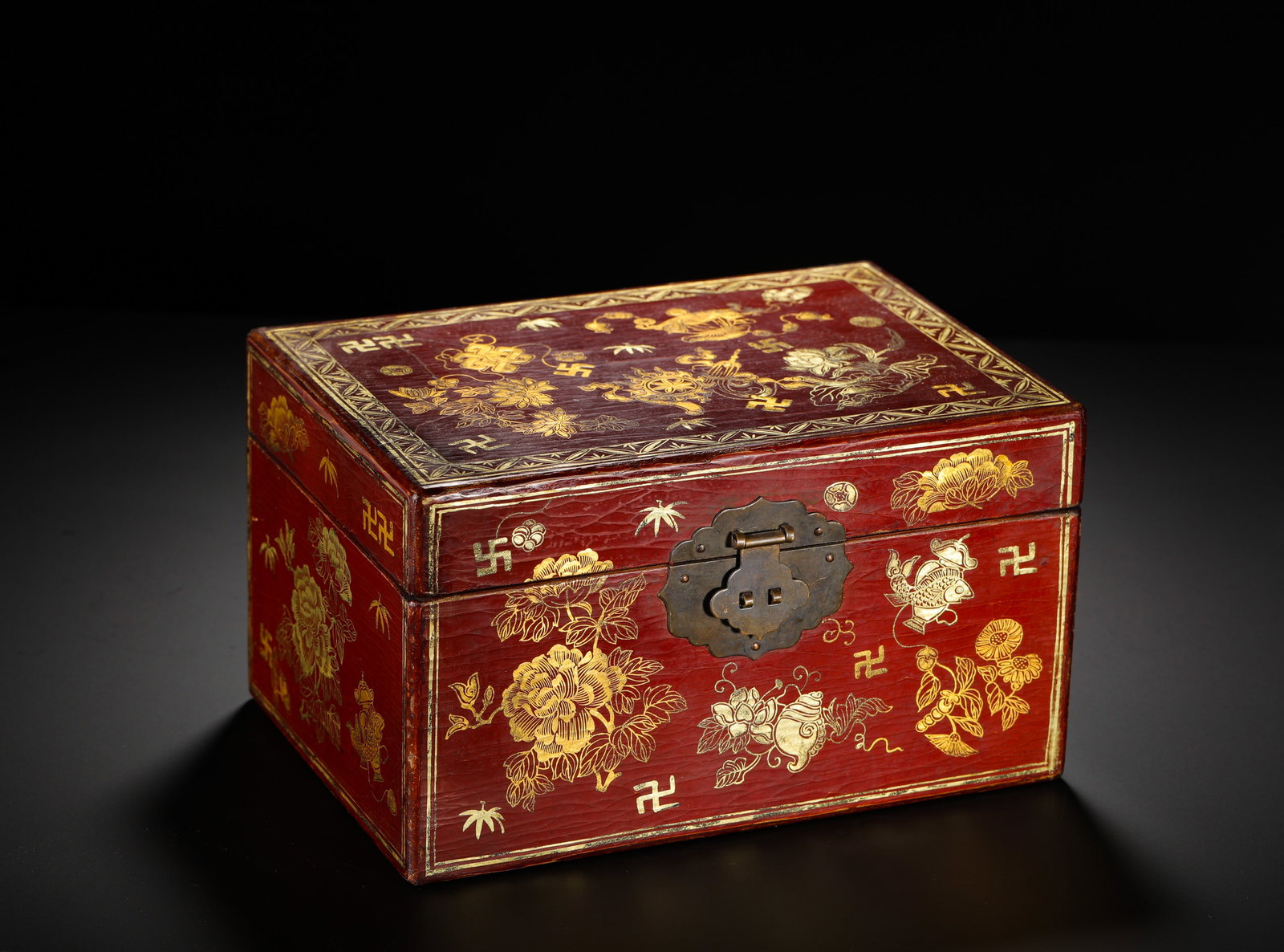 QING DYNASTY QIANLONG RED LACQUER GILDED TREASURE CHEST: Height:14cm(5.51in) Width:23cm(9.06in) Weight:1130g(2.49lb)Wood-cored red lacquer storage box with gold tracing, Qianlong reign of Qing Dynasty. Covered in deep cinnabar lacquer with natural crackled 