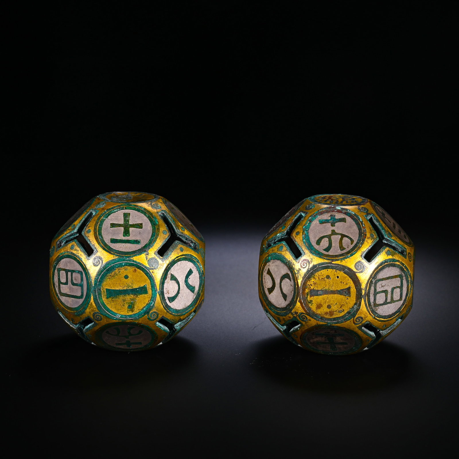 A PAIR OF BRONZE TWELVE-FACED BORONS FROM THE HAN DYNASTY (1 of 9)