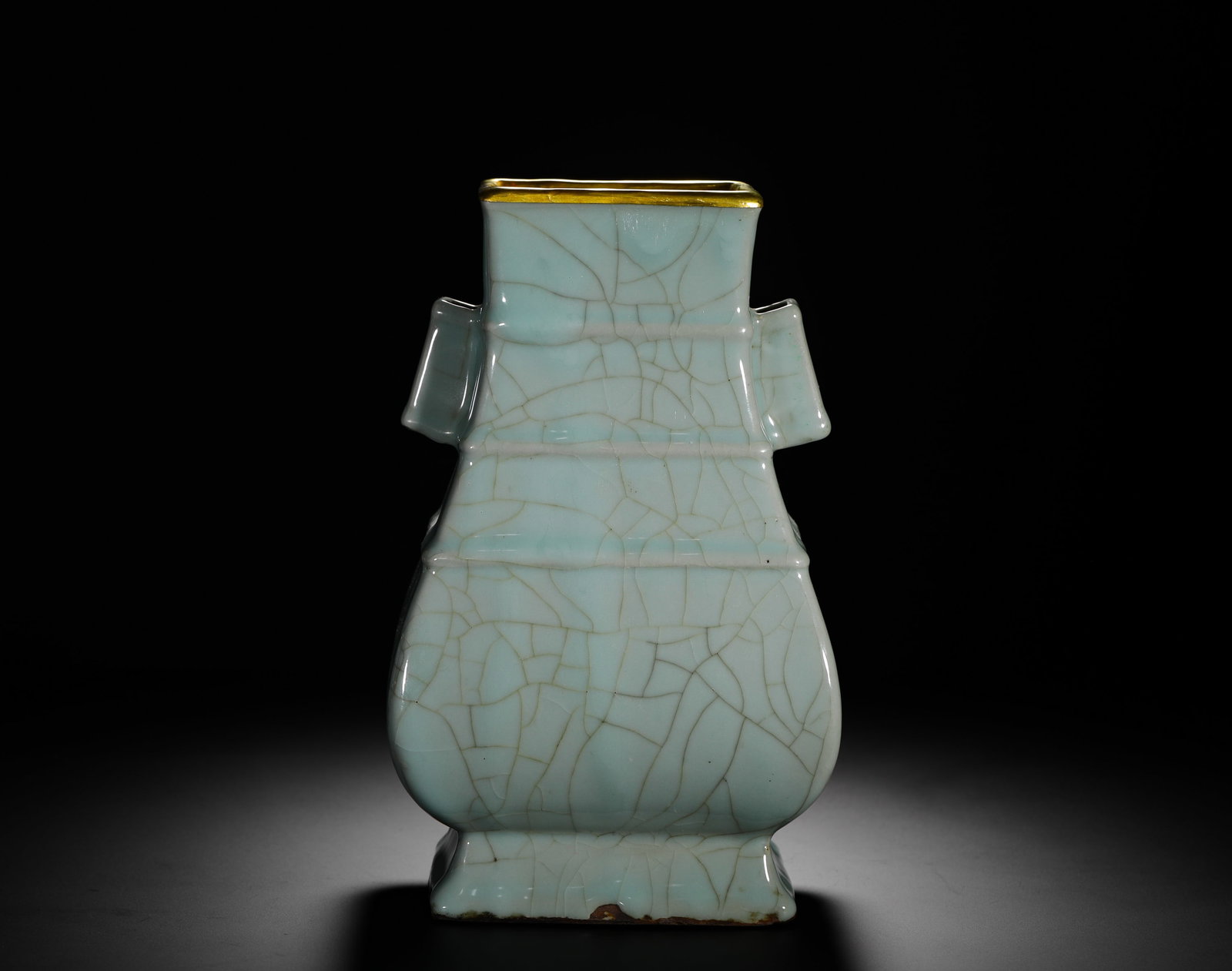 SONG DYNASTY OFFICIAL KILN CELADON GLAZED GOLD-RIMMED EAR-EAR VASE: H:25cm(9.84in) W:15cm(5.91in) Weight:2090g(4.61lb)This is a Song Dynasty Guan Yao celadon vase with tubular handles, one of the representative forms of the period. Modeled after a Han Dynasty touhu wi