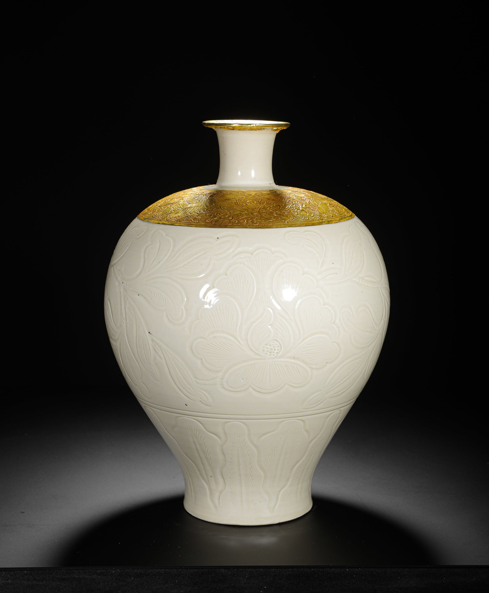 SONG DYNASTY DING KILN WHITE GLAZED ENGRAVED GOLD-ENCRUSTED PLUM VASE: H:35cm(13.78in) D:23cm(9.06in) Weight:2720g(6.00lb)The rim is gilded, and the shoulder is encircled by a band of chased gold with intricate floral scrollwork. The bright gold creates a striking contra