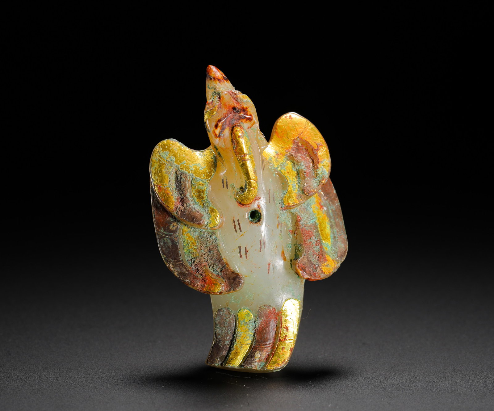 HAN DYNASTY HETIAN JADE INLAID WITH GOLD DIVINE BIRD PENDANTS: Height:6.7cm(2.64in) Width:2.3cm(0.91in) Weight:40g(0.09lb)Han Dynasty white jade owl pendant with gold wire inlay carving. Solid whole-jade bird form with suspension hole on chest, golden lines decor