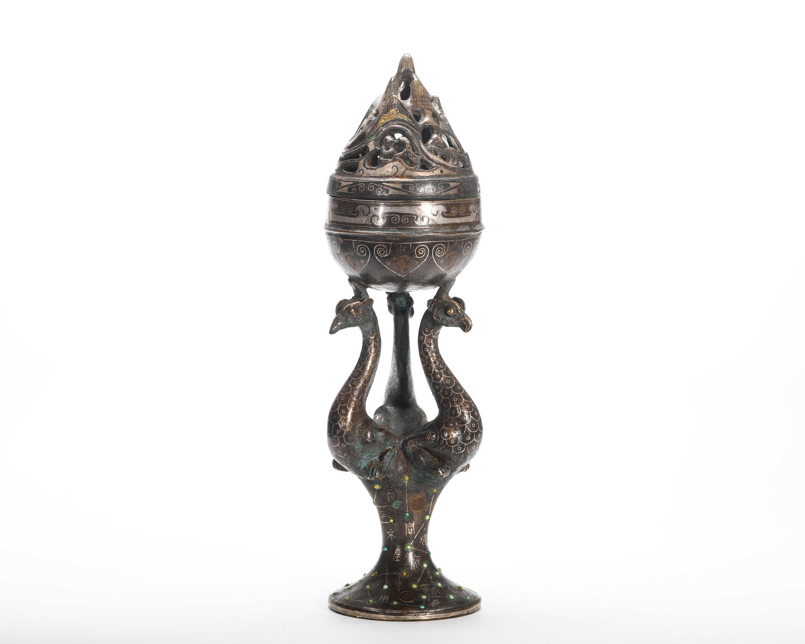 HAN DYNASTY BRONZE INLAID GOLD AND SILVER BOSHAN STOVE: H:25cm (9.84in) W:7.5cm (2.95in) Weight:760g (1.68lb) This is a Han Dynasty-style bronze Boshan incense burner with an openwork mountain-shaped lid. Supported by three phoenix birds, its body is decor