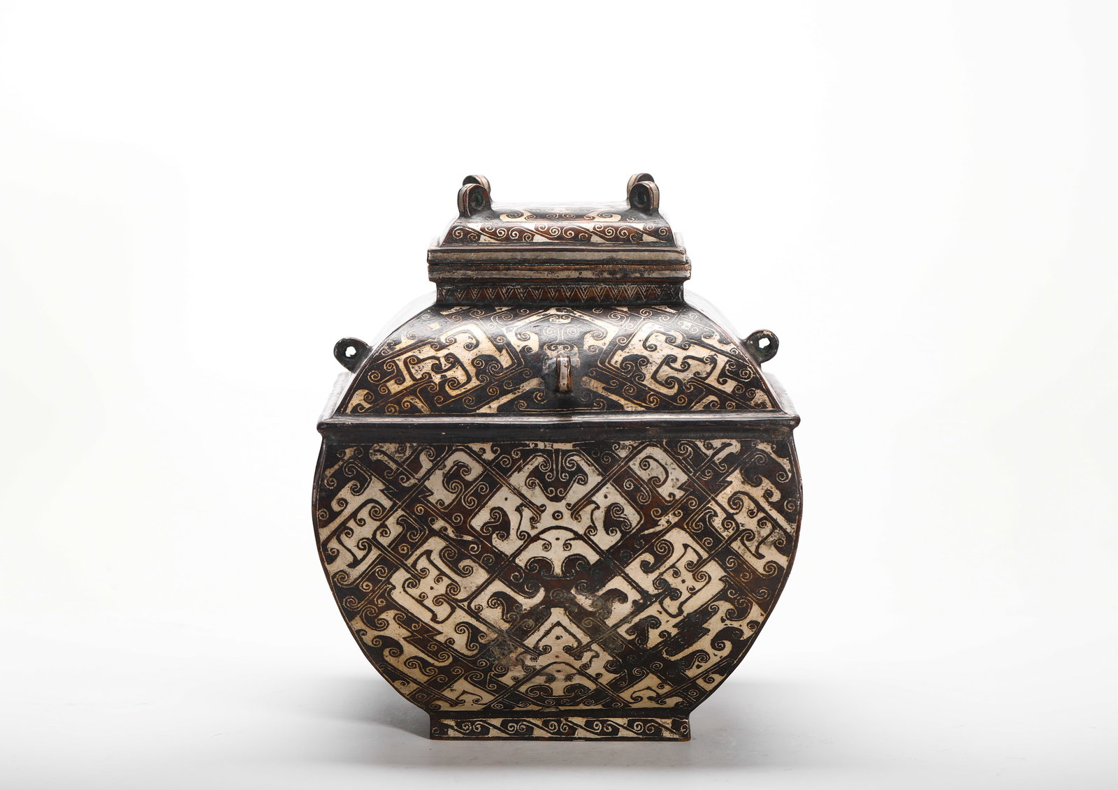 BRONZE INLAID SILVER SQUARE FROM THE WARRING STATES PERIOD ??: H:19cm (7.48in) W:16cm (6.30in) Weight:2230g (4.92lb) This is a Warring States Period-style bronze square lei vessel, fully decorated with silver inlaid geometric and stylized dragon patterns. With pr