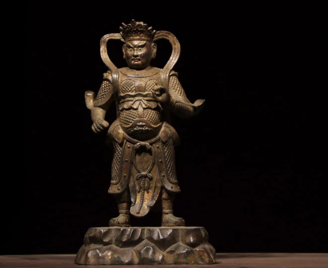A GILDED BRONZE STATUE OF THE GUARDIAN OF THE HEAVENLY KING FROM THE MING DYNASTY (1 of 9)