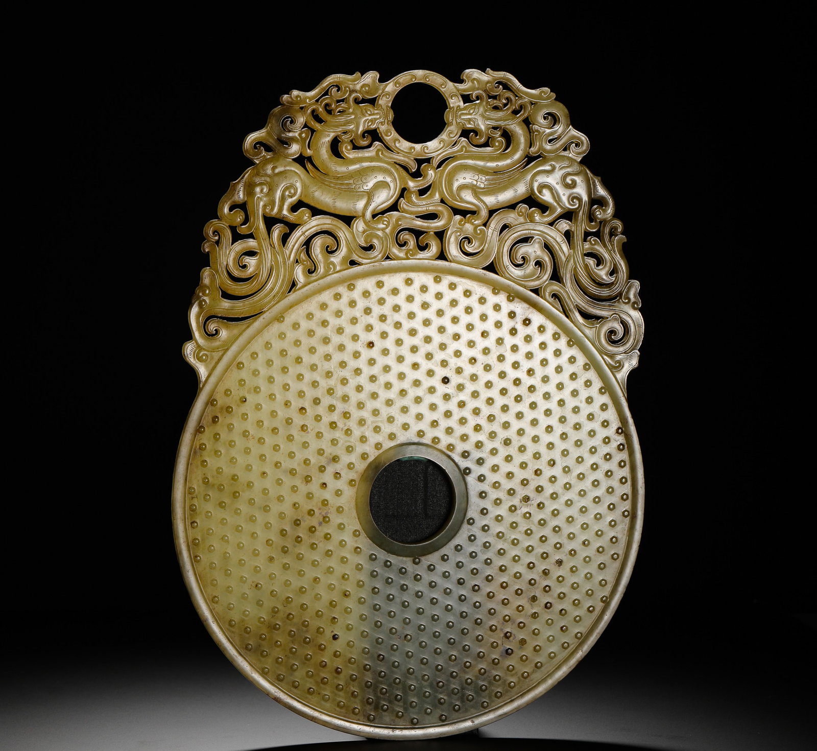 HAN DYNASTY HETIAN JADE BI: Height:35cm(13.78in) Width:35cm(13.78in) Weight:1020g(2.25lb)Outlined jade bi with twin dragons and grain pattern, ancient sacrificial jade.
