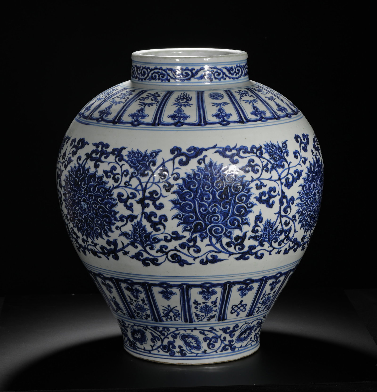 MING XUANDE BLUE AND WHITE LOTUS PATTERNED LARGE JAR: H:52cm (20.47in) D:44cm (17.32in) Weight:11850g (26.12lb)This is a Ming Dynasty porcelain jar from the Jingdezhen Kiln during the Xuande period. Covered in a white glaze with a slight blue tint, the e