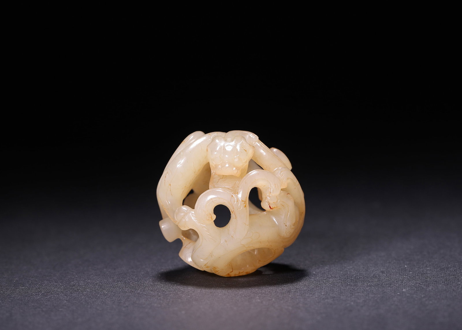 HAN DYNASTY (206 BC-220 AD) OPENWORK HETIAN JADE SPHERE CARVED WITH CHILONG DRAGONS (1 of 7)