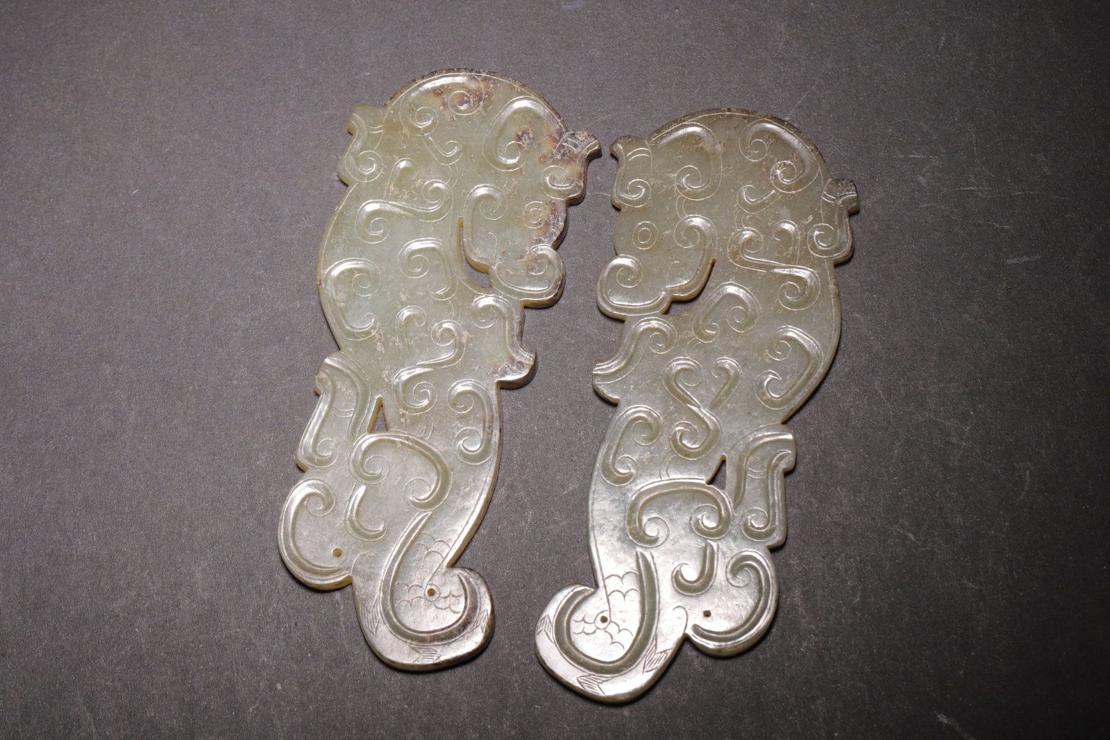 PAIR OF YELLOWISH CELADON JADE S-DRAGON PENDANTS, SPRING AND AUTUMN PERIOD (770 BC-476 BC) (1 of 7)