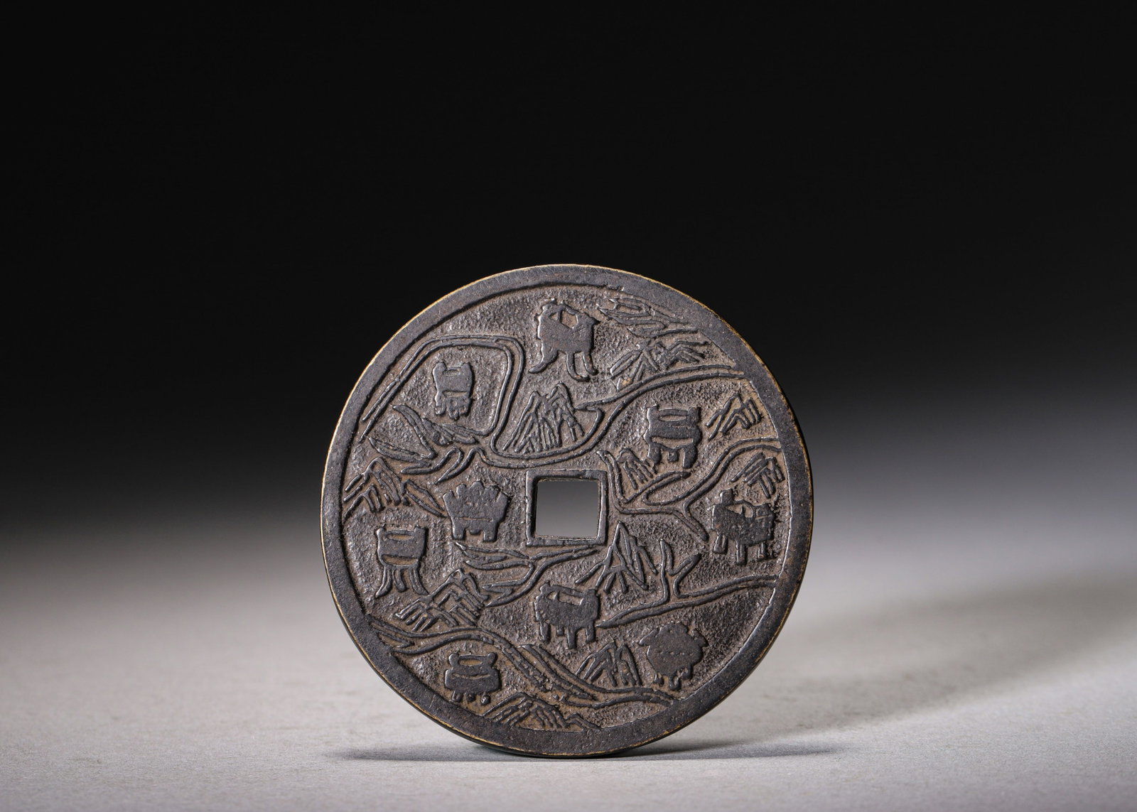 Gilt Bronze 18-Sided Drinking Game Die with Silver Inlay and Gemstone Inlays, Han Dynasty (202: D 4.2cm (1.654 in); Wt 98g (0.216 lb)This 18-sided bronze die was used for Han dynasty banquet drinking games. It features gilt and silver-inlaid archaic numerals and toast inscriptions, with turquois