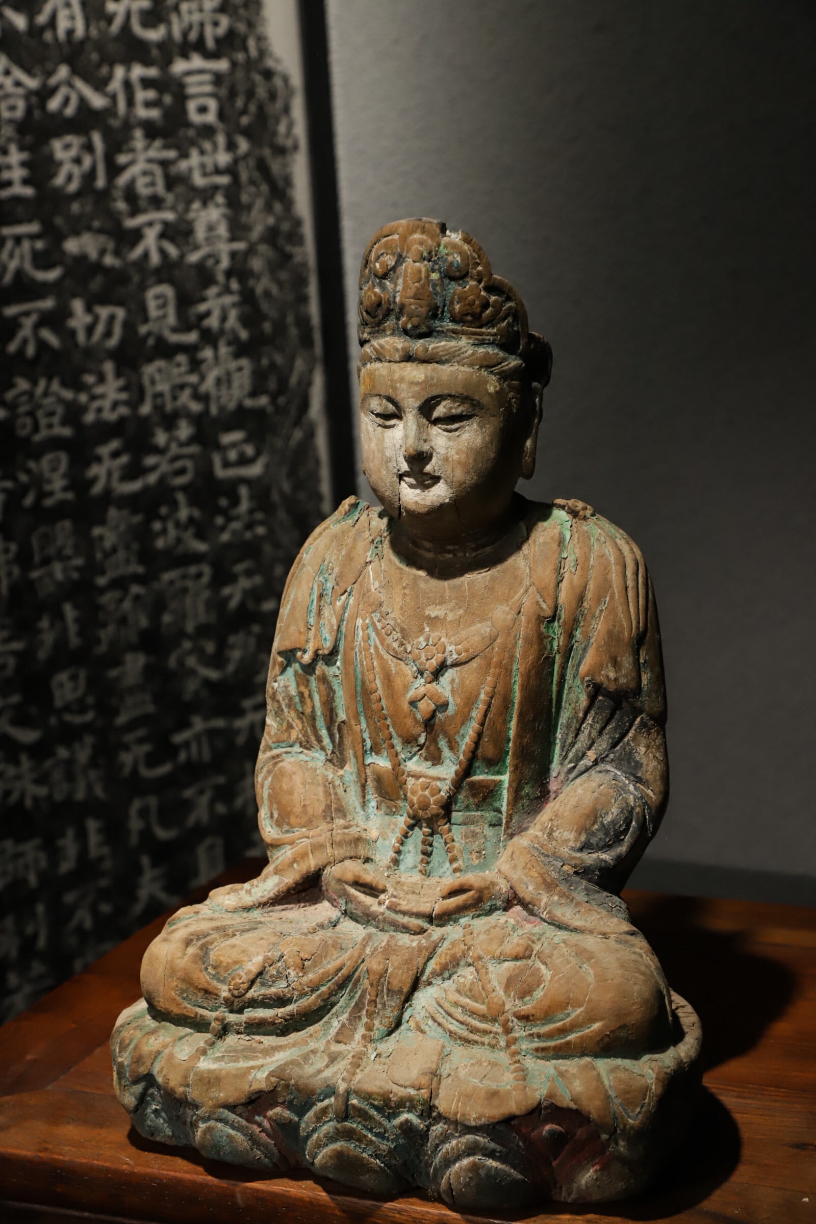 PAINTED WOODEN SEATED GUANYIN BODHISATTVA (SONG DYNASTY, 960-1279 AD): H 38cm (14.96 in); L 25cm (9.84 in); W 18cm (7.087 in),Polychrome wood sculpture. Guanyin sits in full lotus posture on a lotus throne. She wears an ornate crown with a mild, serene face and gently lo