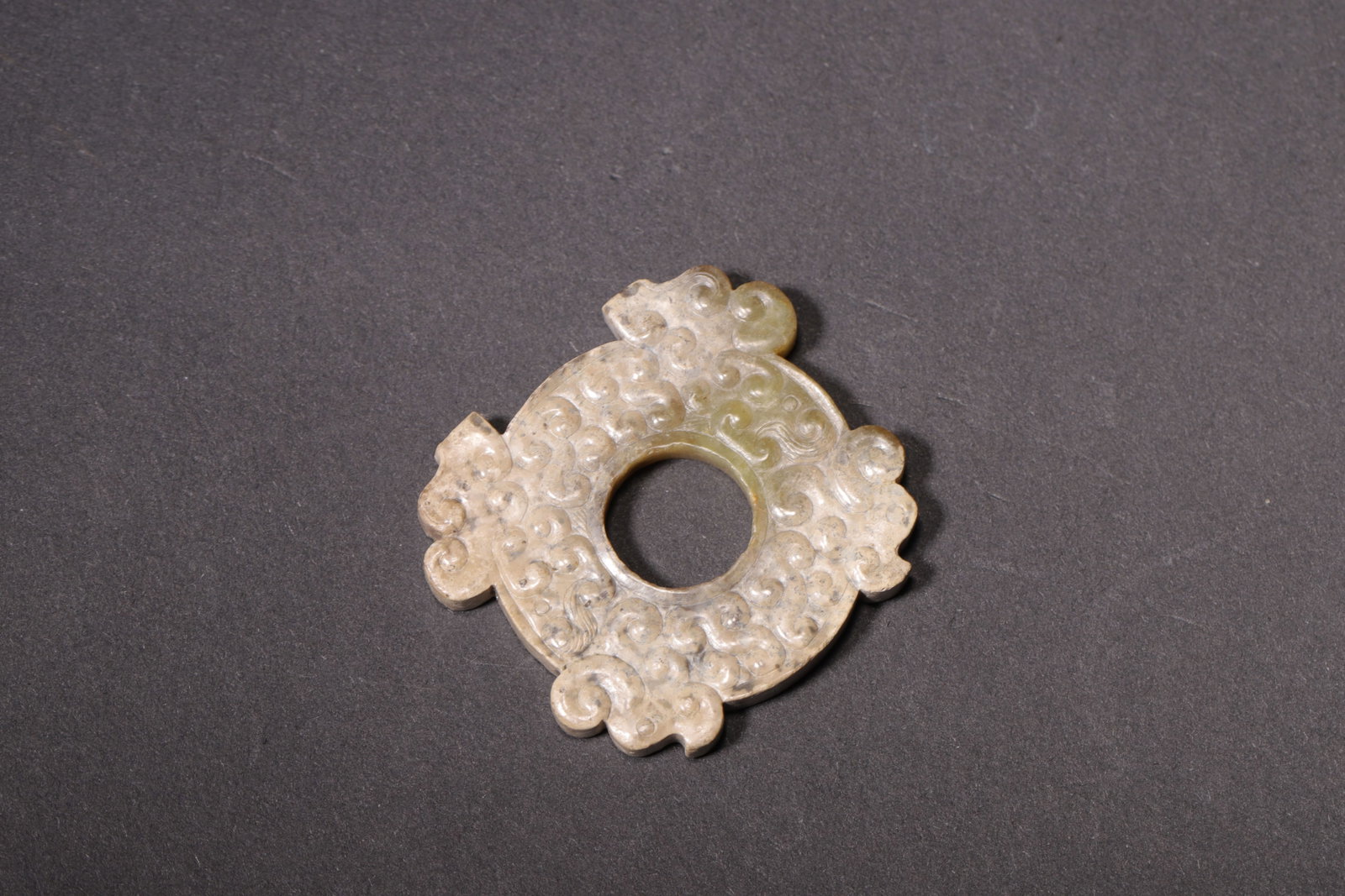 CARVED JADE BI WITH OUTWARD FLANGES, WARRING STATES PERIOD (475-221 BC) (1 of 6)