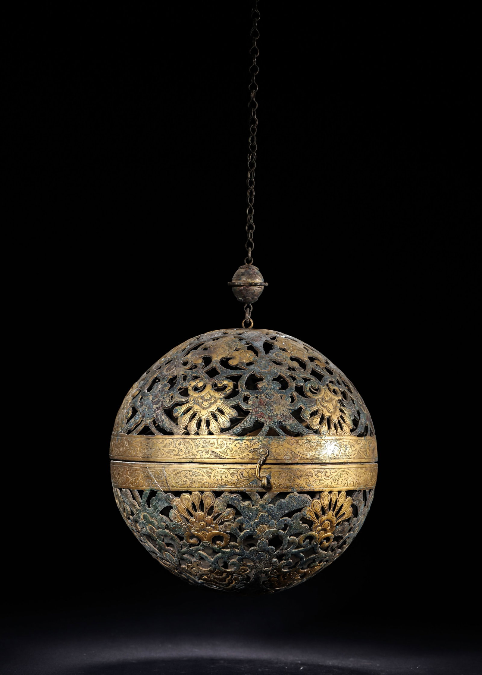 GILT SILVER OPENWORK POMANDER WITH INTERTWINED FLORAL AND BIRD MOTIFS, TANG DYNASTY (618-907): D 18cm (7.087 in); Wt 856g (1.89 lb),Spherical pomander opening via hinge, exterior openwork chased with scrolling flowers and birds with gilded finish. Fitted with gimbal mechanism and incense bowl i