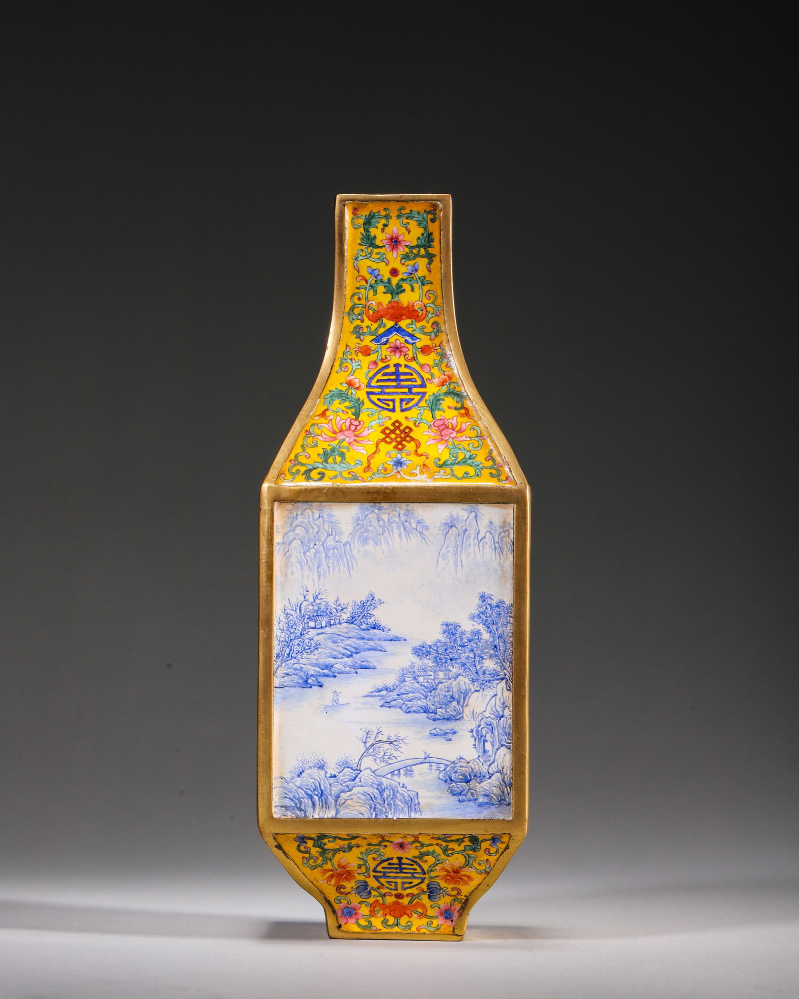 COPPER-BODY PAINTED ENAMEL YELLOW-GROWTH SQUARE VASE WITH LANDSCAPED PANELS, QIANLONG PERIOD, QING: L 6.5cm (2.56 in); W 6.5cm (2.56 in); H 18.5cm (7.28 in); Wt 661g (1.46 lb),Gilt-framed copper body, decorated with scrolling flora, bats and longevity characters on yellow ground. Four rectangular pa