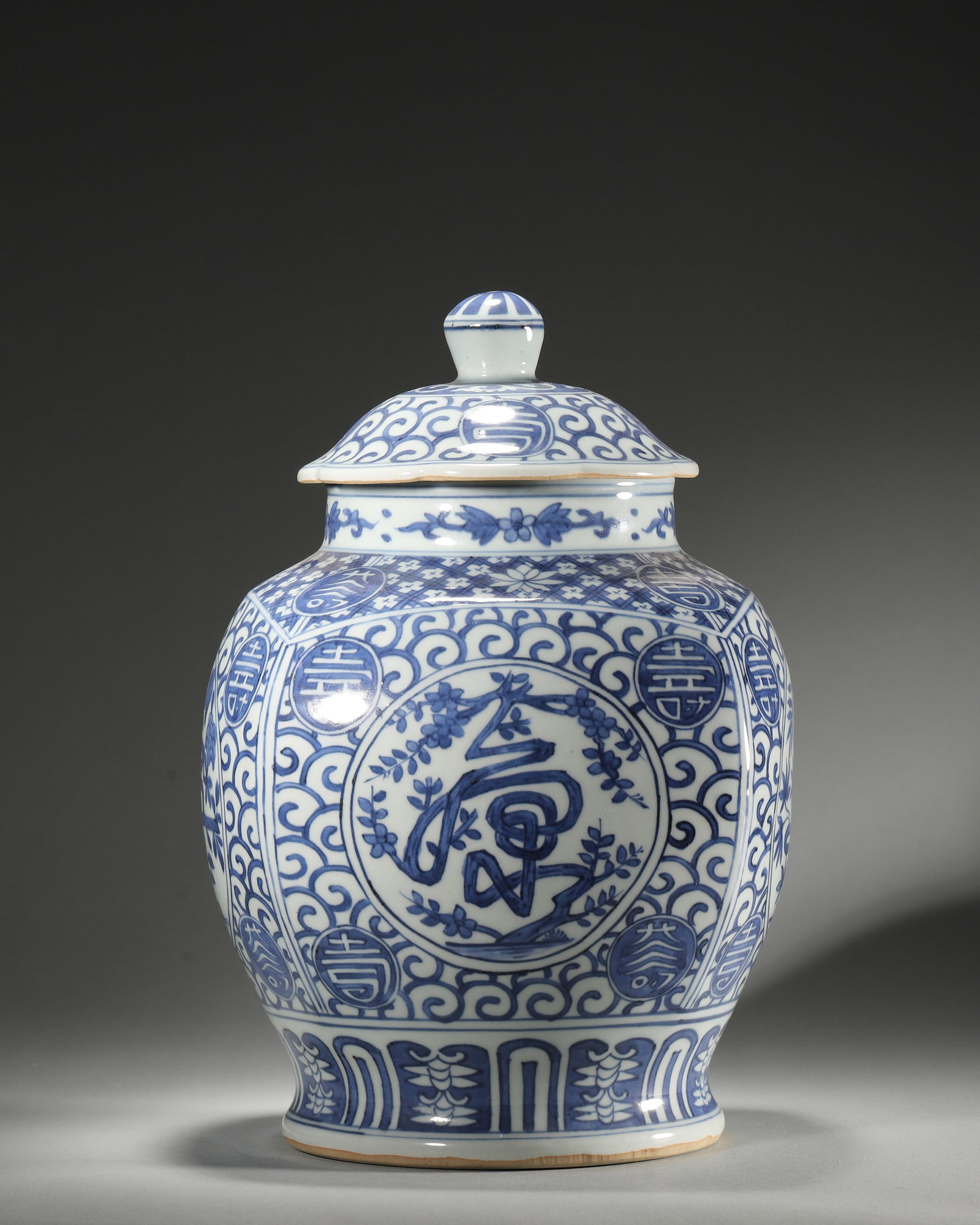 BLUE AND WHITE MELON-RIBBED COVERED JAR WITH FU LU SHOU CHARACTERS, JIAJING PERIOD, MING DYNASTY: D 19cm (7.48 in); H 28cm (11.02 in); Wt 2617g (5.77 lb),Melon-shaped jar with flower-rimmed cover and pearl finial. Painted in rich cobalt blue, set against scrolling foliage diaper ground. Four reser