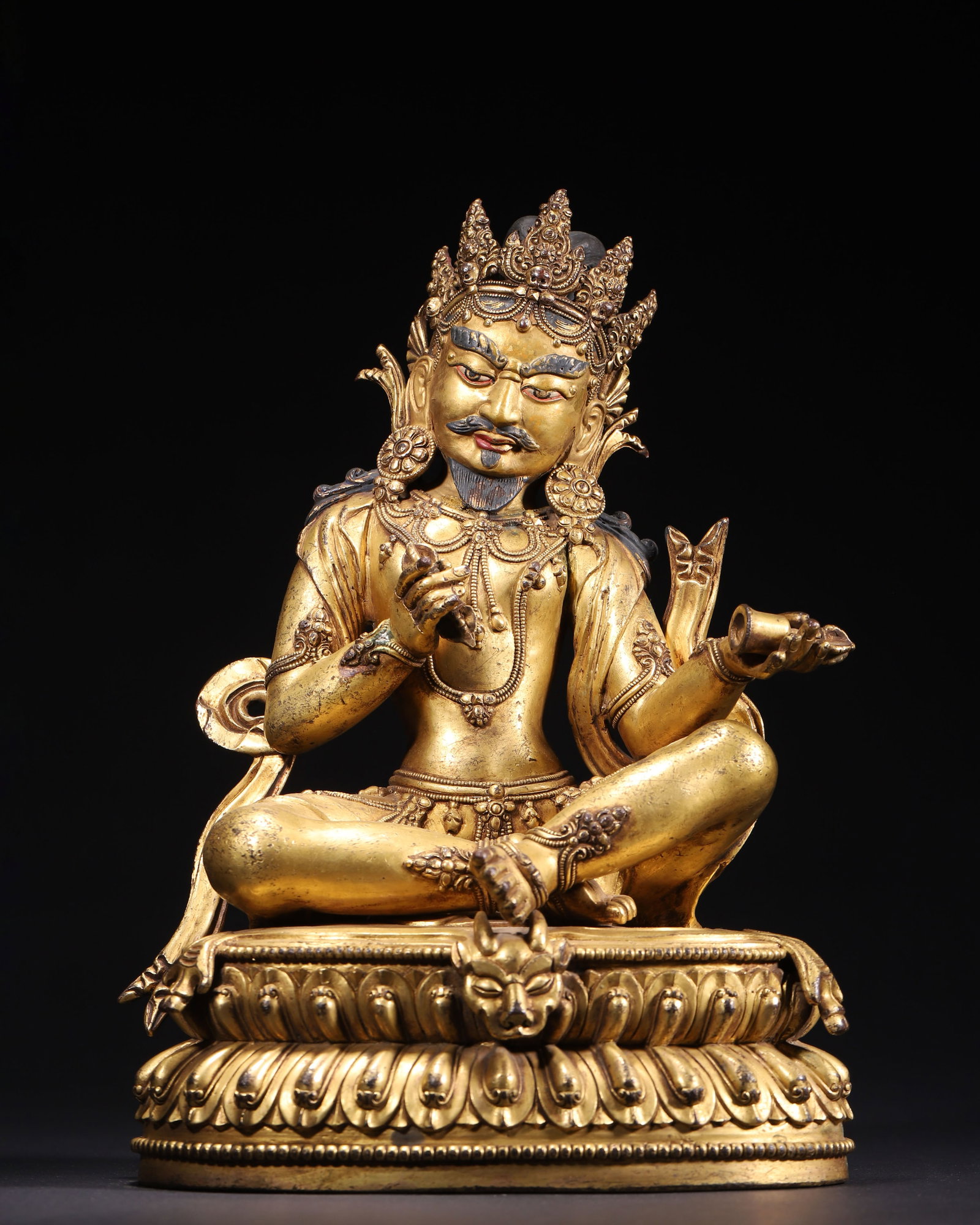 GILT BRONZE VAJRADHARA SEATED FIGURE, QING DYNASTY (1644-1912 AD): L 19.00cm (7.48 in); W 13.00cm (5.12 in); H 27.00cm (10.63 in); Wt 4736.00g (10.44 lb),Cast in copper with full gilding. The deity wears a five-leaf crown, bears a bearded wrathful countenance, seated