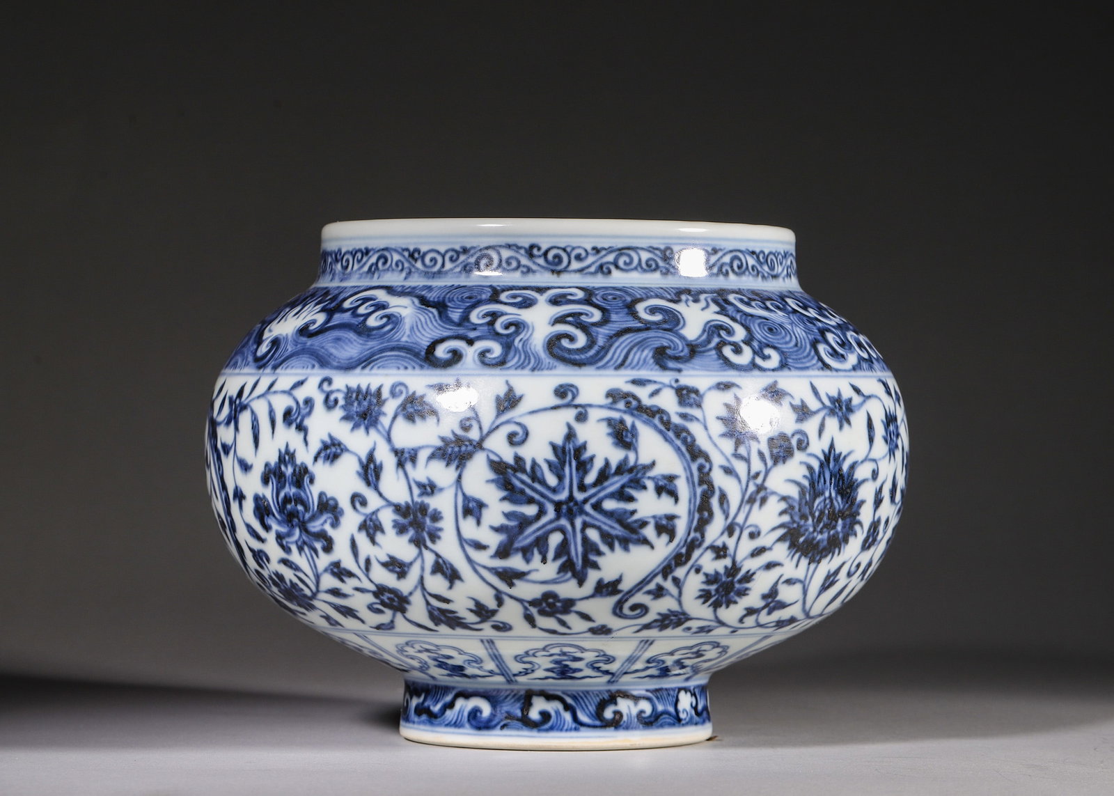 A BLUE AND WHITE JAR WITH WAVE AND FLORAL SCROLLS, XUANDE PERIOD MING DYNASTY (1 of 8)