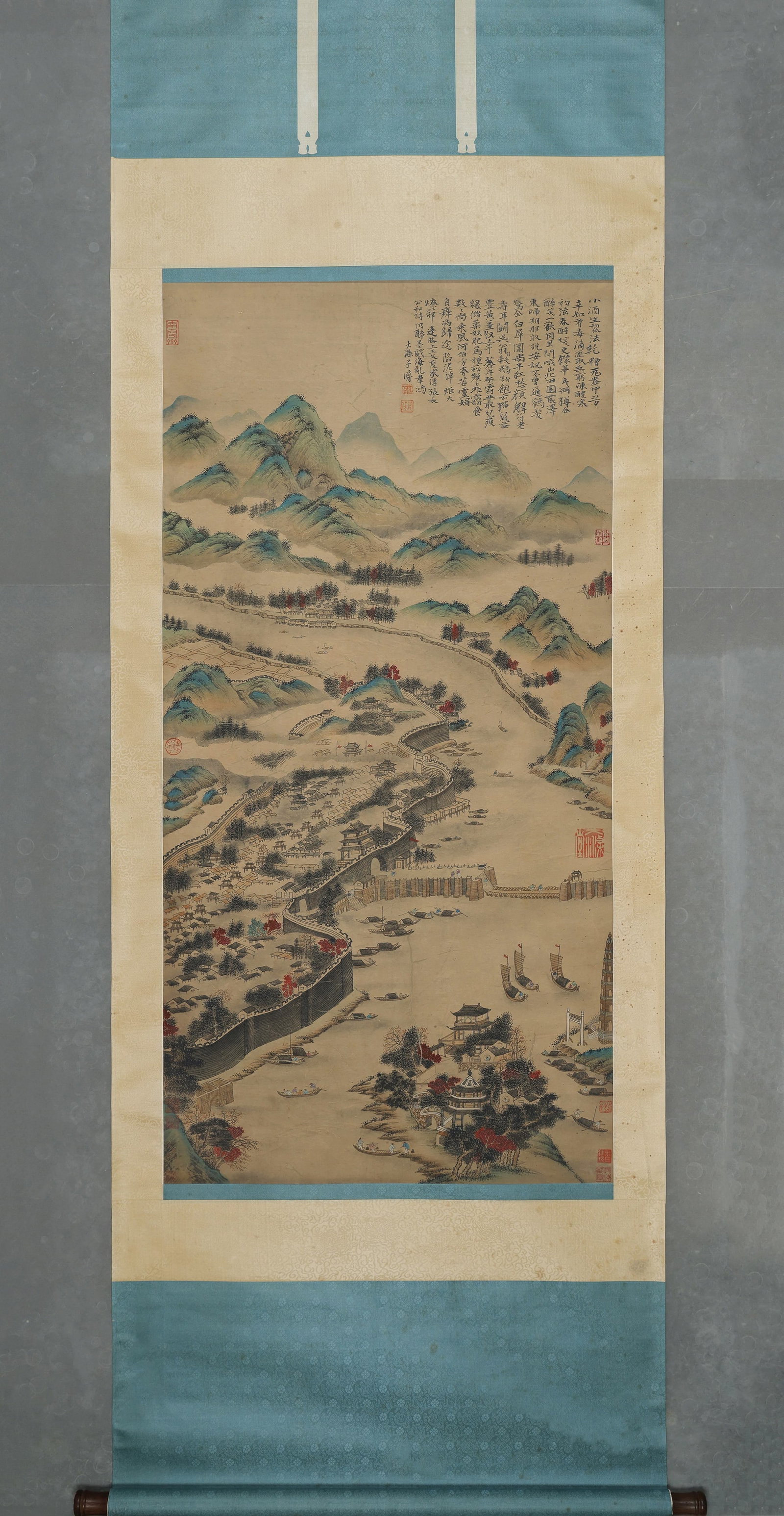 SHI TAO (1642-C.1718 AD), RIVERSIDE CITYSCAPE, HANGING SCROLL, INK AND COLOUR ON PAPER: Image L 135cm (53.15 in) x Image W 66cm (25.98 in),Depicts a riverside walled city in Jiangnan with layered mountains, winding ramparts, sailing boats, pagoda and pavilions. Inscribed with lengthy poe