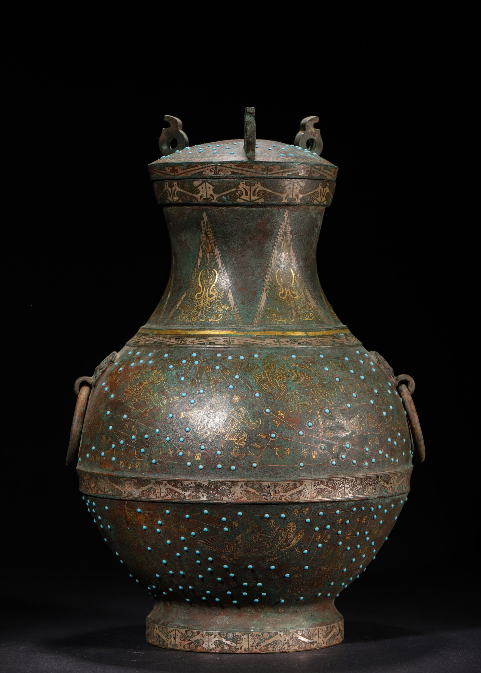 BRONZE COVERED HU WITH GOLD & SILVER INLAY, TURQUOISE AND ASTRONOMICAL FOUR-DIVINE BEASTS, WARRING: H 35cm (13.78 in); D 22cm (8.66 in); Wt 4879g (10.76 lb),Cast bronze covered hu with original lid, slender neck and rounded belly flanked by beast-head ring handles. The vessel is decorated in horizon