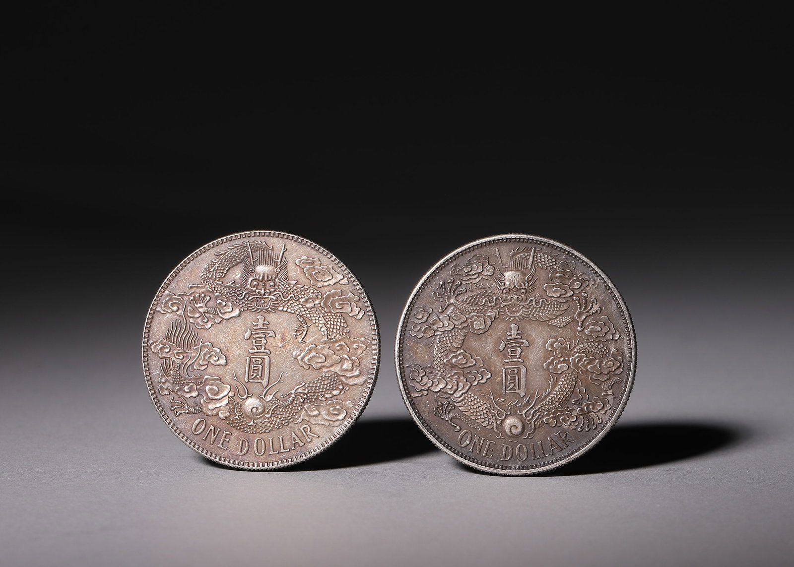 A GROUP OF TWO SILVER COINS, GREAT QING SILVER COIN ONE DOLLAR, 3RD YEAR OF XUANTONG, QING DYNASTY (1 of 7)