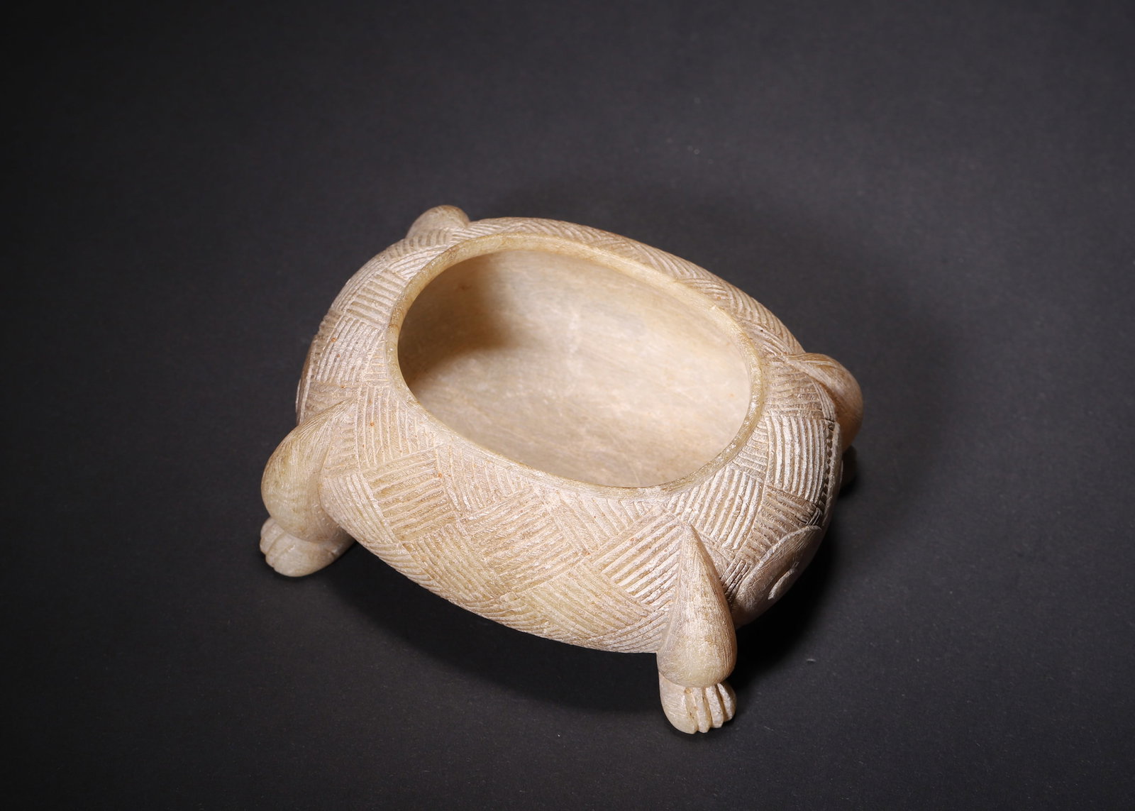 ANCIENT JADE FOUR-LEGGED BEAST FORM WATER POT, HAN DYNASTY (202 BC?C220 AD): L 10.00cm (3.94 in); W 8.00cm (3.15 in); H 4.00cm (1.57 in); Wt 266.00g (0.59 lb),Solid carved ancient jade water vessel modelled after a beast with four sculpted paws for support. The exterior fully 