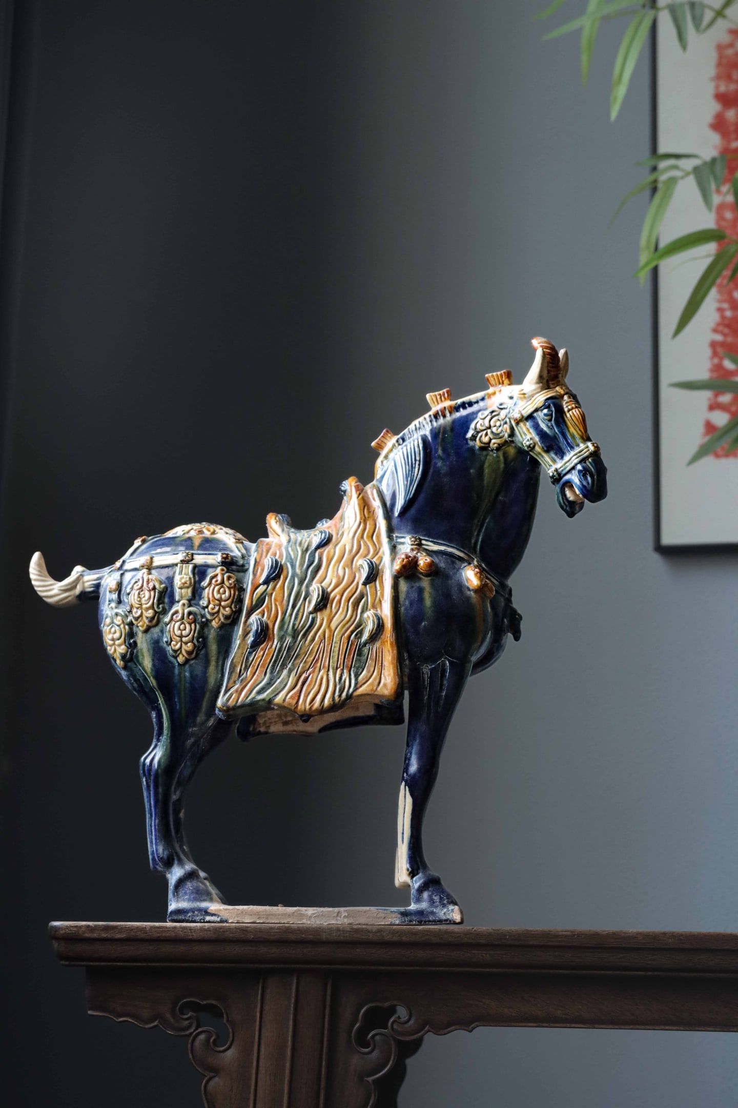 Tri Color Blue Glazed Saddled Horse, Tang Dynasty (618 907): H 43cm (16.93 in); L 42cm (16.54 in); W 16cm (6.299 in)Tri color pottery horse with dominant blue glaze mixed with yellow and green. Fully equipped with finely moulded trappings, robust form, typical 