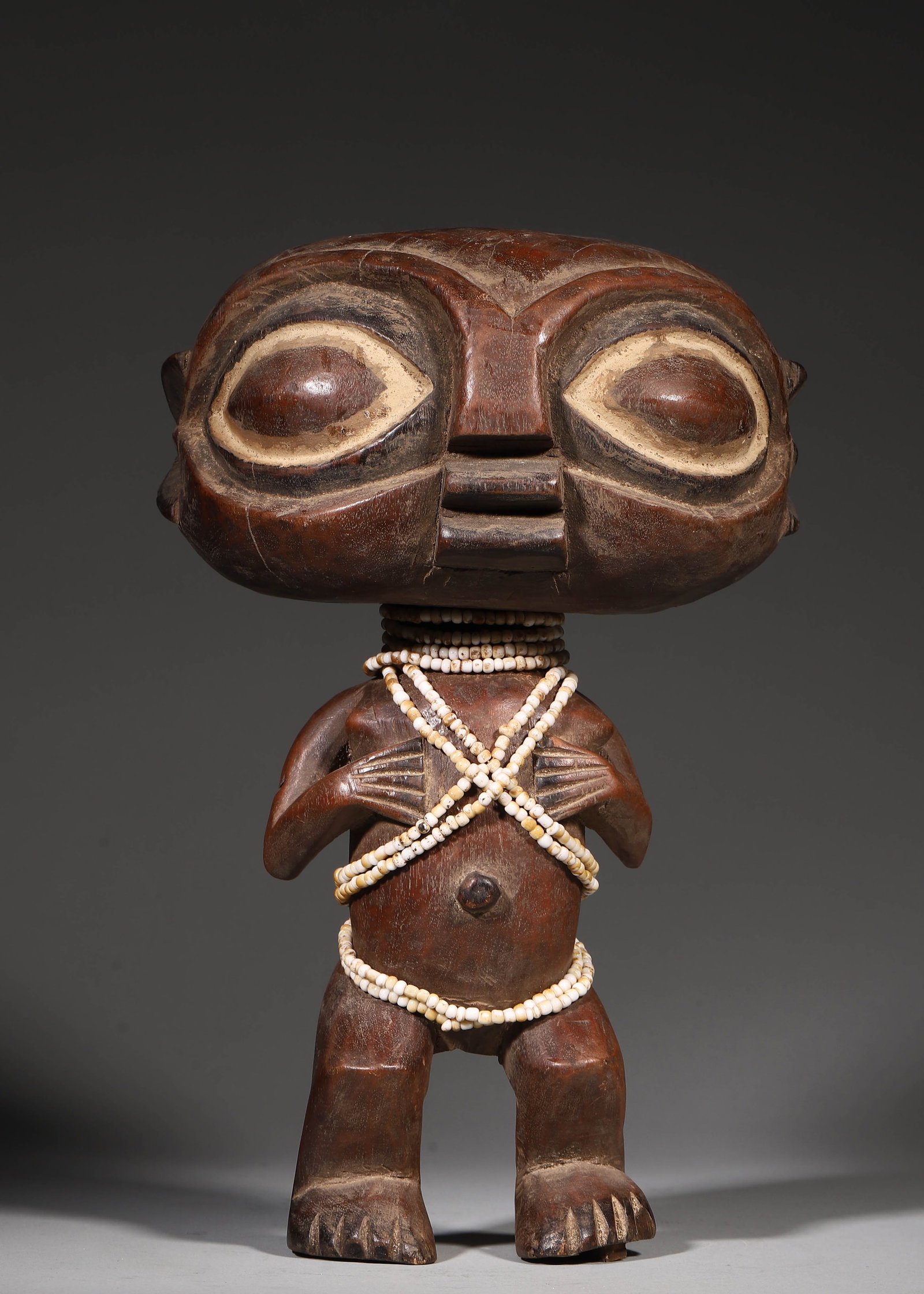 Laughing Monkey Mask, Wood, Cameroon West Africa, Dating To 19Th Century: H 30cm (11.81 in); L 20cm (7.87 in); W 14cm (5.51 in); Wt 1268g (2.79 lb)Solid block round carved wooden figures with large heads and shortened limbs of the Central African Pygmy communities date to t