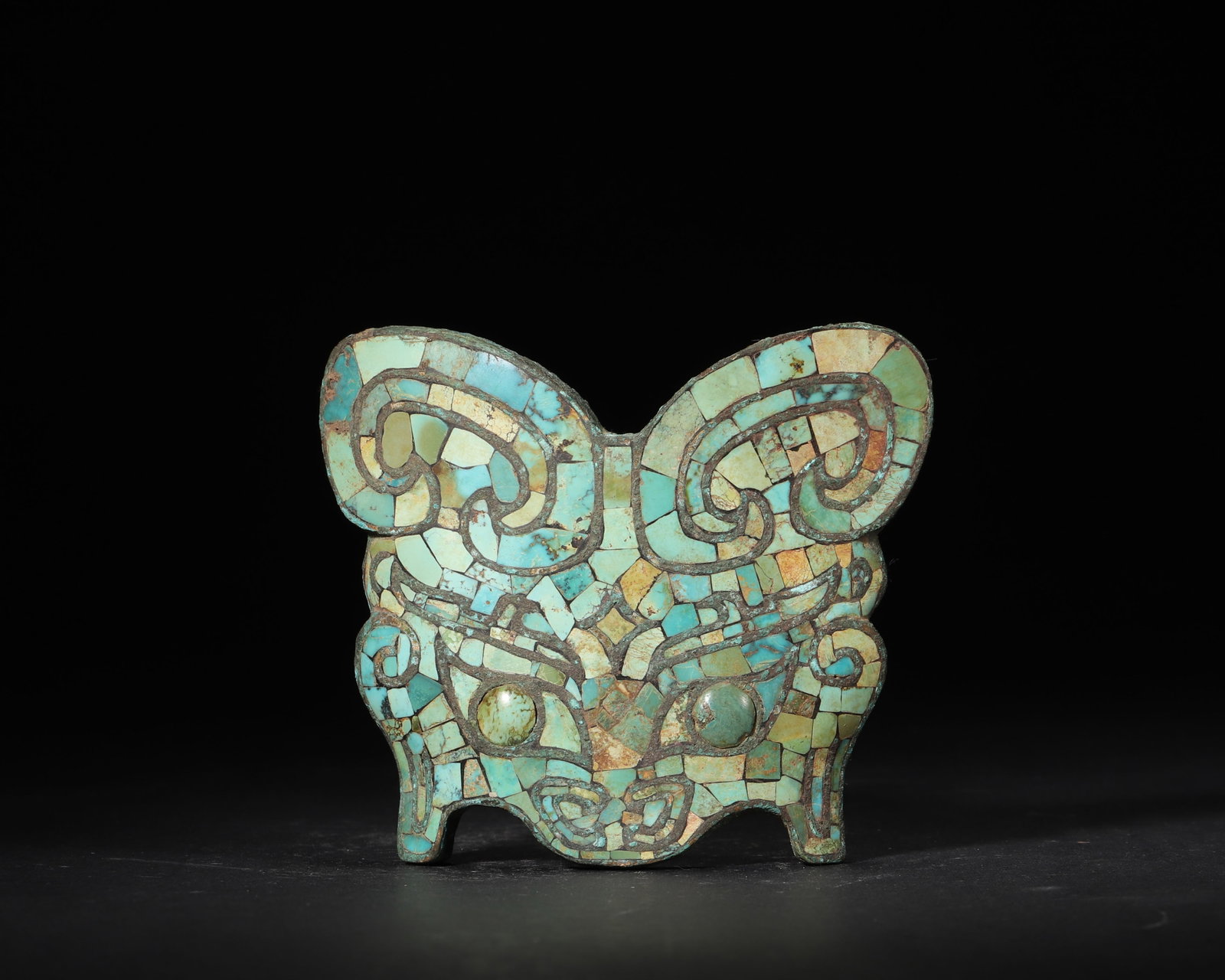 Warring States Period Bronze Ornament With Turquoise Inlay, Decorated With Taotie Mask Pattern: 7.87in x 11.81in (20.0cm x 30.0cm), 6.786lb (3078.0g)A Warring States bronze ornament inlaid with turquoise, featuring a fierce Taotie mask pattern outlined by bronze wires. With three loop buttons on