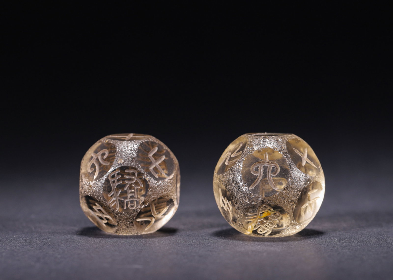 Pair Of Crystal Eighteen Sided Dice, Han Dynasty (202 Bc 220 Ad): Wt 71g (0.16 lb); W 2.8cm (1.102 in)A matched pair of eighteen sided dice carved from natural crystal. Smoothly polished, each facet incised with archaic seal numerals and inscriptions in succinct anc