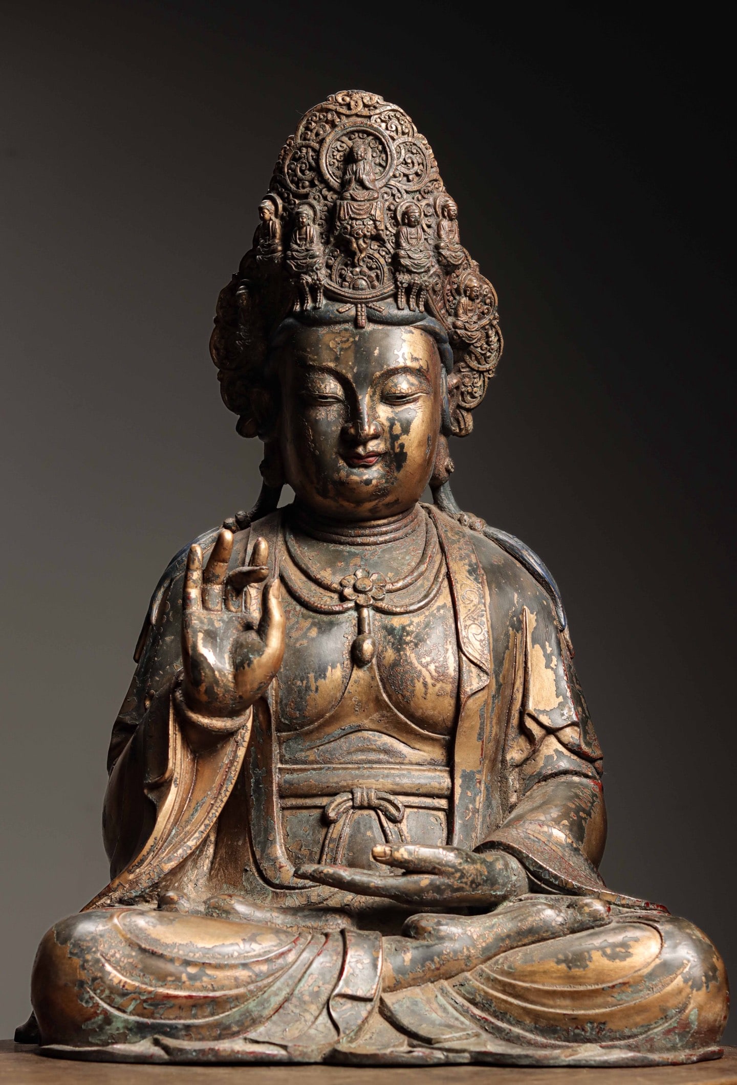 Gilt Lacquered Bronze Seated Guanyin, Qing Dynasty (1644 1912): Wt 19100g (42.11 lb); H 56cm (22.047 in); W 38cm (14.96 in); D 32cm (12.598 in)The deity sits in lotus position with elaborate crown and neck ornaments. Right hand in teaching mudra, gilt lacquer part