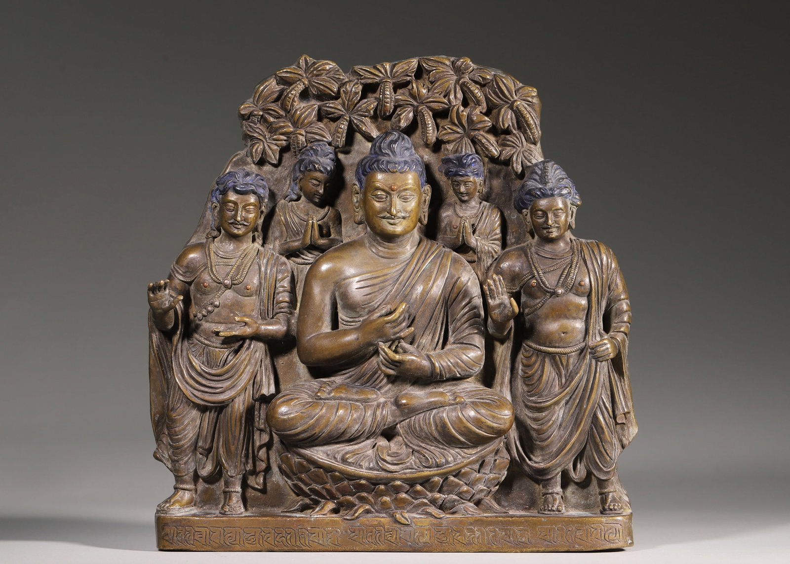Bronze Shakyamuni Preaching Group Sculpture, Gandhara Style (2Nd 4Th Century): H 23cm (9.06 in); L 22cm (8.66 in); W 3.5cm (1.38 in); Wt 2.98kg (6.57 lb)Cast bronze. Seated Shakyamuni on lotus pedestal in preaching mudra, flanked by bodhisattvas and disciples. Backplate with car