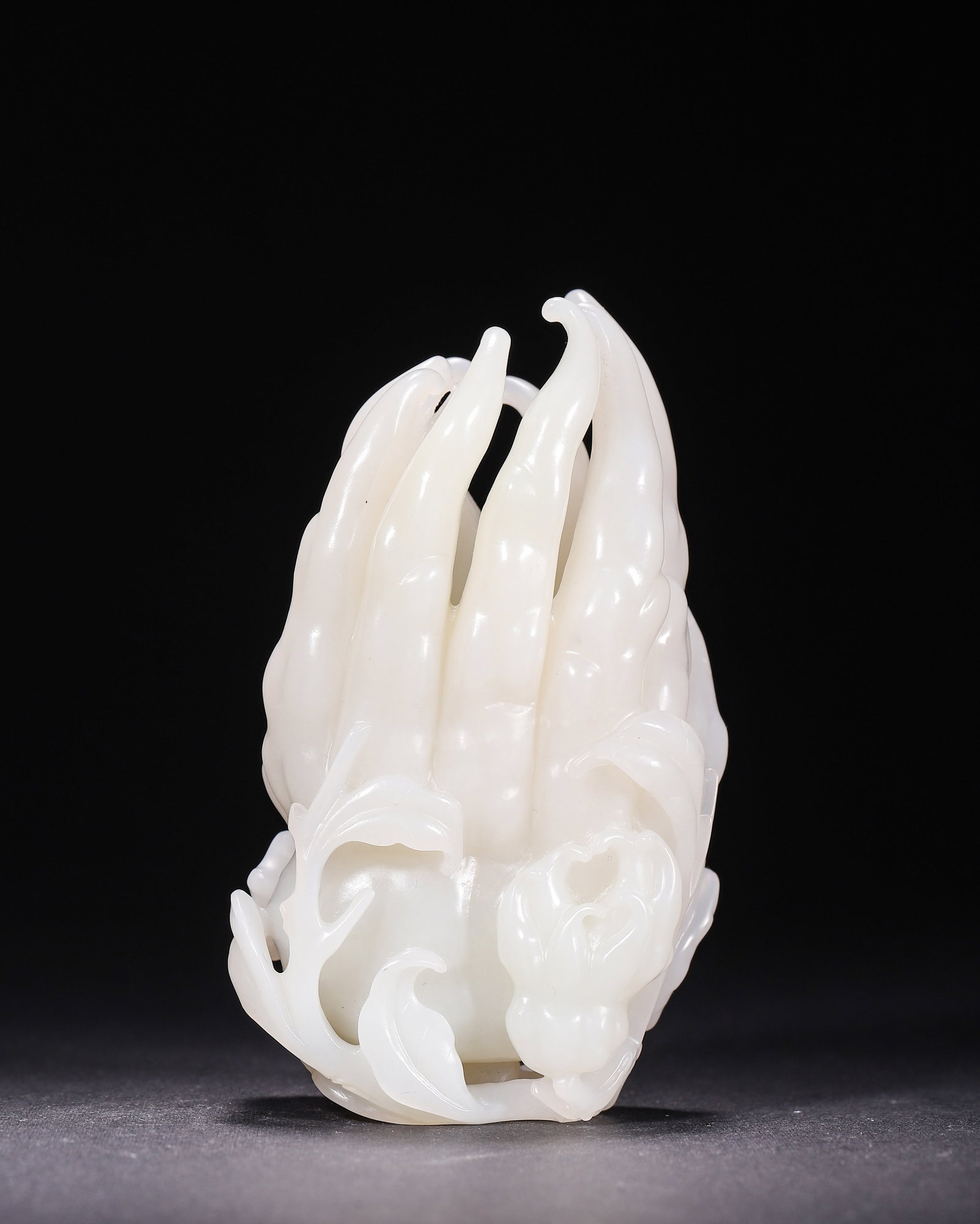 Hetian Jade Bergamot Ornament, Qing Dynasty: H 10.6cm (4.17 in); W 5.5cm (2.17 in); D 4.1cm (1.61 in)Carved of fine Hetian white jade. Fully rounded bergamot with open fingers, small bergamot and leaves in openwork. Skillfully executed, an auspi