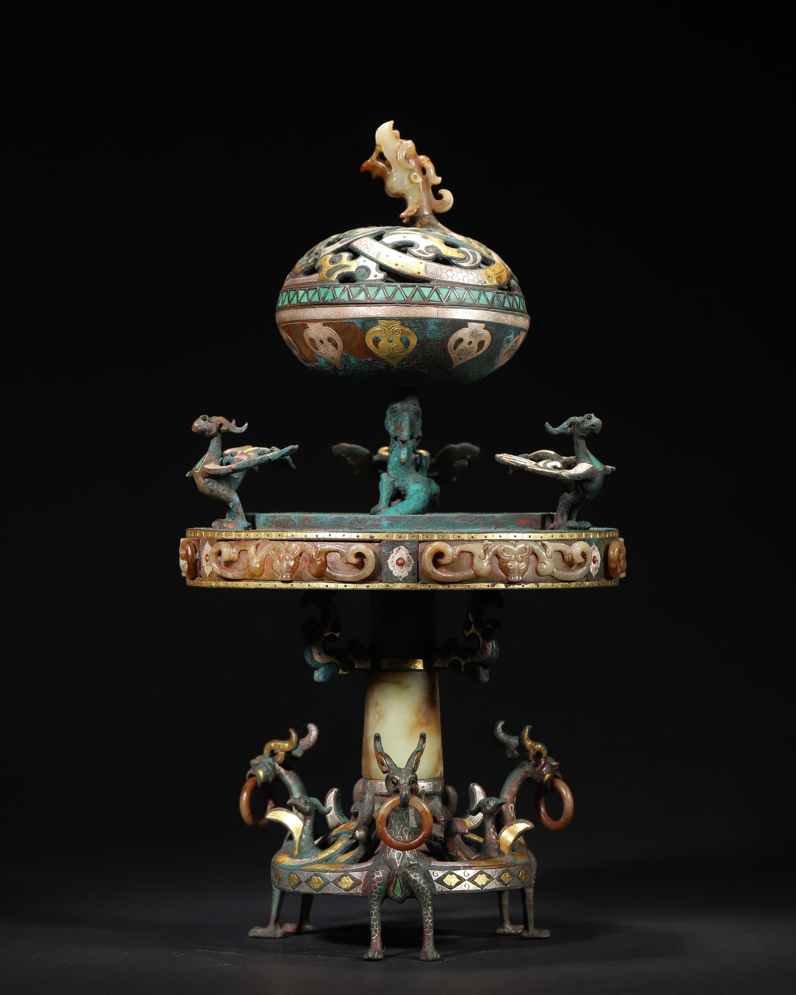 Han Dynasty Bronze Boshan Censer With Inlaid Gold, Silver, Gemstones And Jade, Decorated With: 8.27in x 14.57in (21.0cm x 37.0cm), 8.417lb (3818.0g)A Han Dynasty bronze Boshan censer with openwork lid, inlaid with gold, silver, turquoise and jade. It features mythical birds and beasts, jade inl
