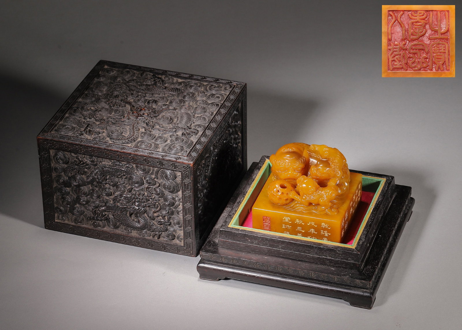 Tianhuang Stone Imperial Seal, Grand & Young Lions Knob, Mark "Treasure Of Filial Piety", With Zitan: Wt 828g (1.83 lb),L 8cm (3.15 in),W 8cm (3.15 in),H 7cm (2.76 in)Imperial square seal carved from premium Tianhuang stone with warm amber hue and naturally glossy patina. The knob is elaborately carve