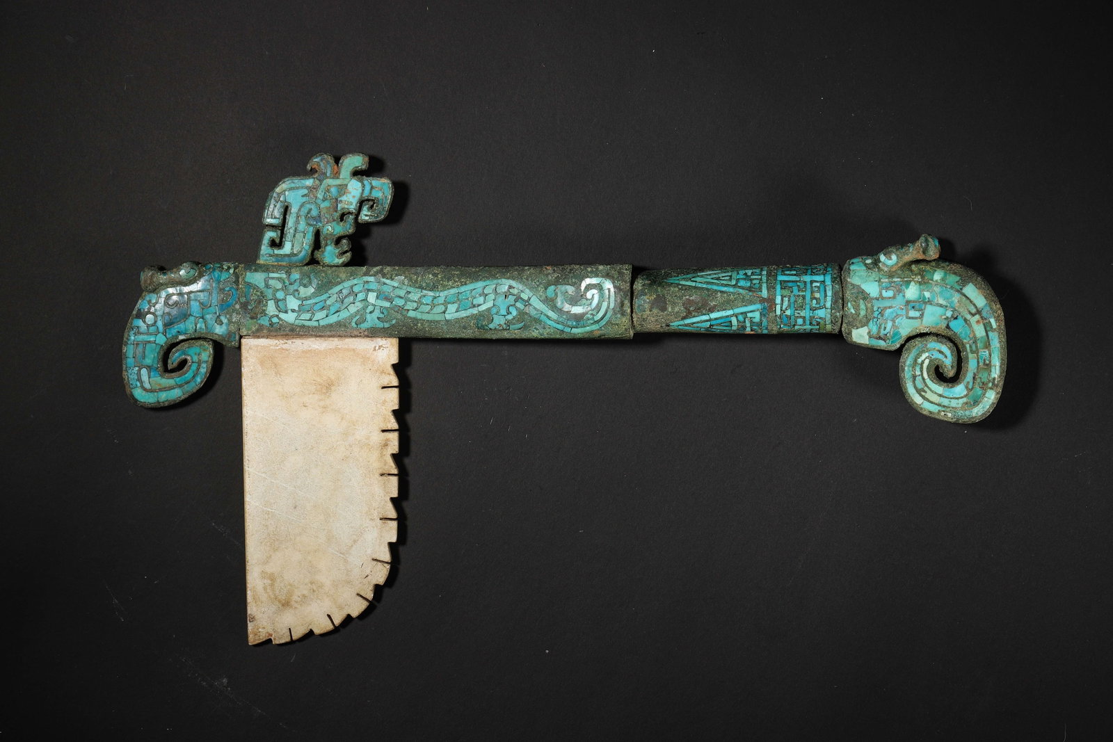 Western Zhou Dynasty Turquoise Inlaid Jade Bladed Bronze Dagger Axe: Length 30.0cm (11.81in), Width 17.0cm (6.69in), Weight 830.0g (1.83lb)c. 1046 771 BCE. Bronze Back Inlaid with Turquoise Dragon Patterns; Blade Made of Jade. Combines Jade Gold Inlay Craft. A Rare Rit