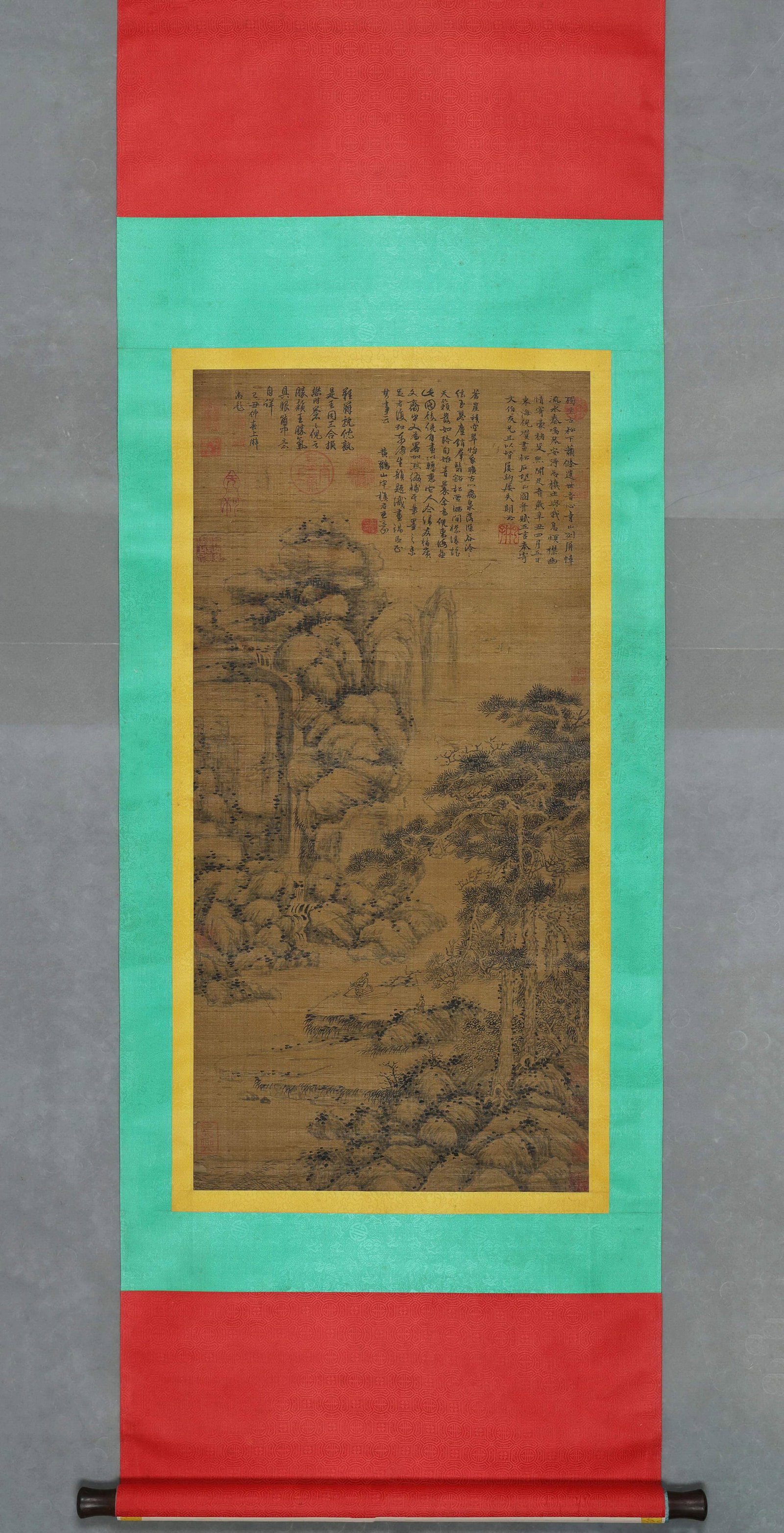 Hanging Scroll Of Pines And Rocks By Ni Zan, Yuan (1271 1368): Image L 99cm (38.98 in) Image W 48cm (18.898 in)Silk ink hanging scroll, depicts ancient pines, rocks, waterfall and reclining scholar. Sparse tranquil composition, covered with historic poems and sea