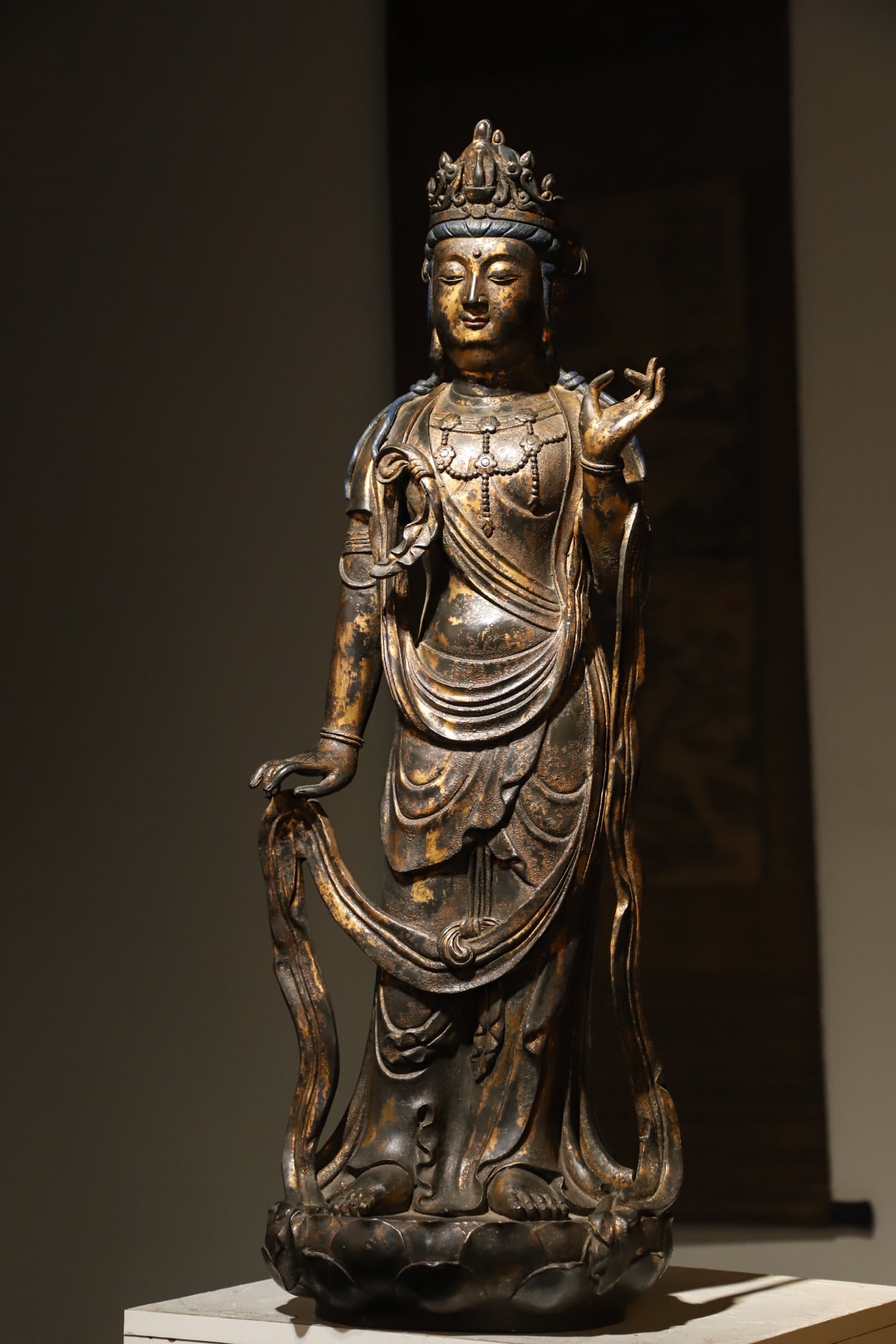 Gilt Bronze Standing Guanyin Bodhisattva, Ming Dynasty (1368 1644): Wt 13000g (28.66 lb); H 82cm (32.28 in); L 28cm (11.024 in); W 26cm (10.24 in)Gilt bronze figure. Bodhisattva stands on lotus base with serene face and jeweled crown. Elaborate ornaments and flowing r