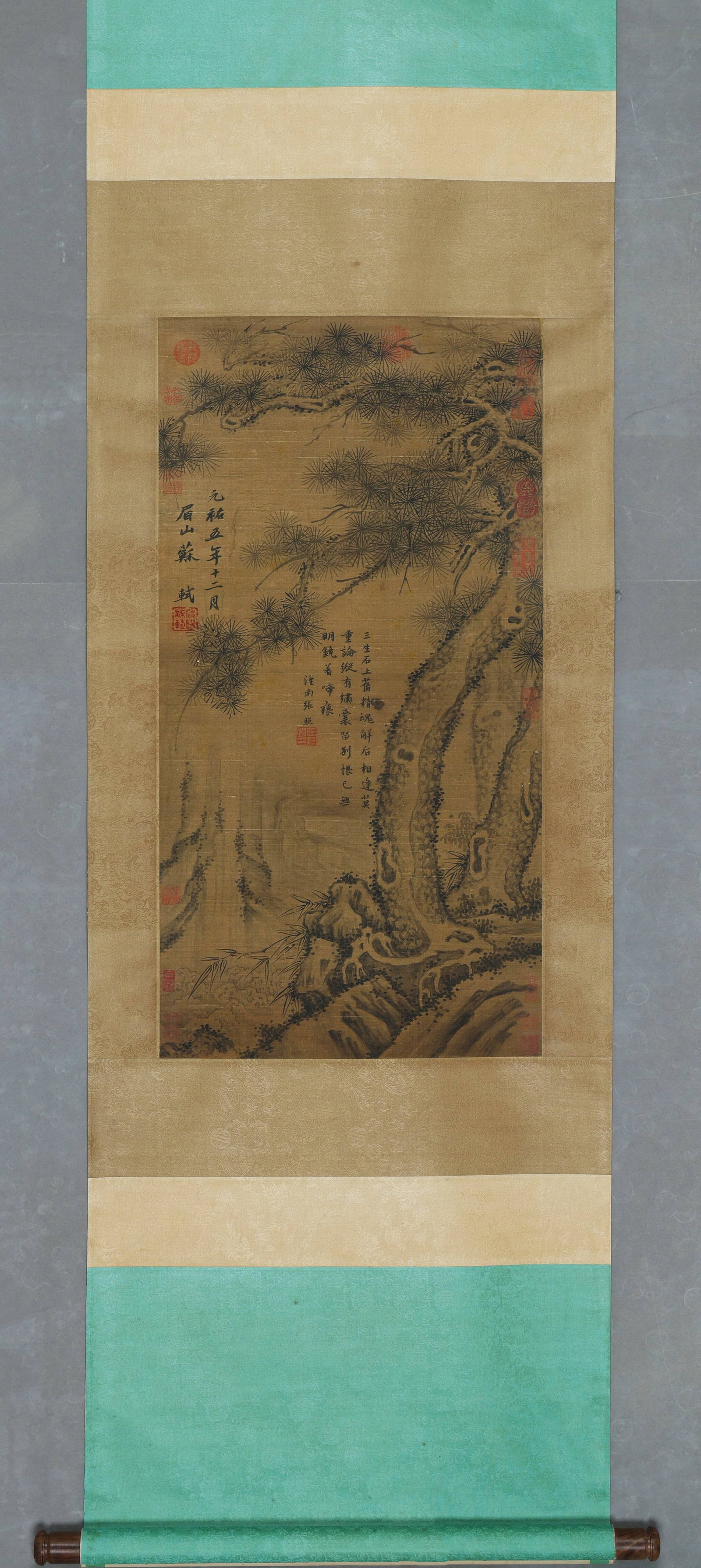 Ancient Pine Hanging Scroll, After Su Shi, Song Dynasty (960 1279): Image L 80cm (31.496 in) Image W 42cm (16.54 in)Ink on silk hanging scroll, original mounting. It depicts gnarled pine, rocks and distant mountains, with inscriptions, poem and multiple collector seal