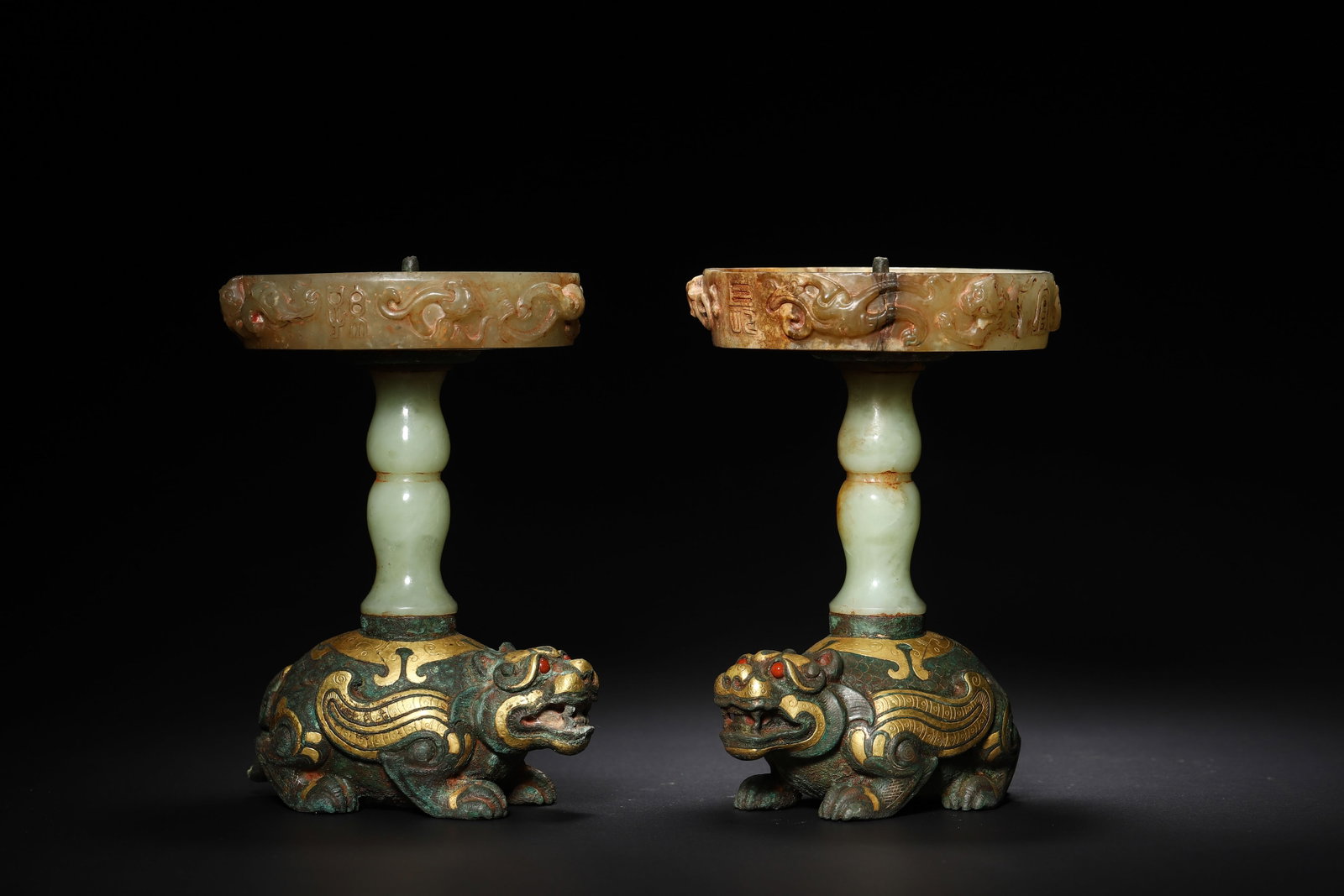 Han Dynasty Pair Of Gold And Silver Inlaid Jade Mythical Beast Lamps: Diameter 8.0cm (3.15in), Height 12.0cm (4.72in), Weight 596.0g (1.31lb)Bronze body with gold inlays of mythical beast patterns, inlaid with Hetian jade tray and pillars, set with gemstones. As a survi