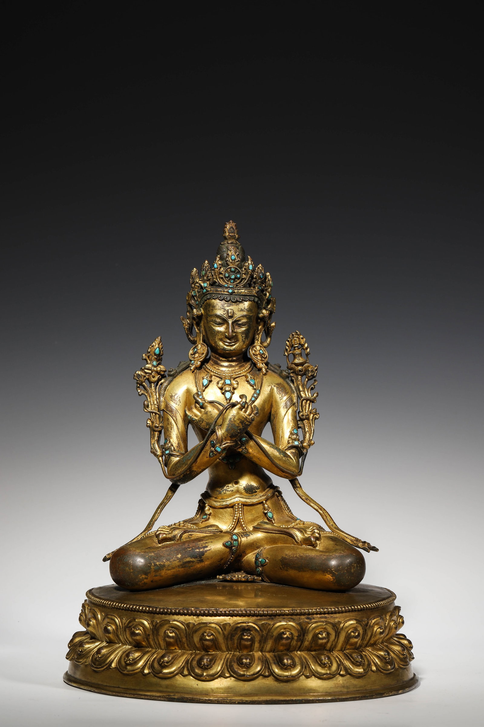 15Th Century, Gilt-Bronze Vajradhara Seated Figure Inlaid With Turquoises: 15th-century gilt-bronze Vajradhara in lotus position, hands crossed holding vajra and bell, bejewelled crown and ornaments inlaid with turquoise. Well-formed double lotus base engraved with double va