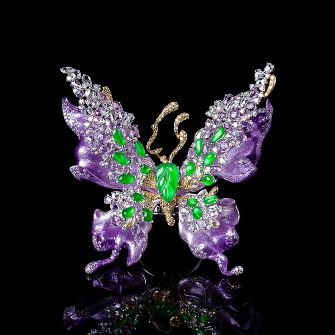 18K Gold Inlaid Butterfly Brooch-Pendant Triple-Use Piece: Butterfly form with purple enamel wings, accented by green gemstones and clear diamonds. Mounted in 18k gold setting. Designed as a versatile contemporary jewel, wearable as brooch, pendant and multip