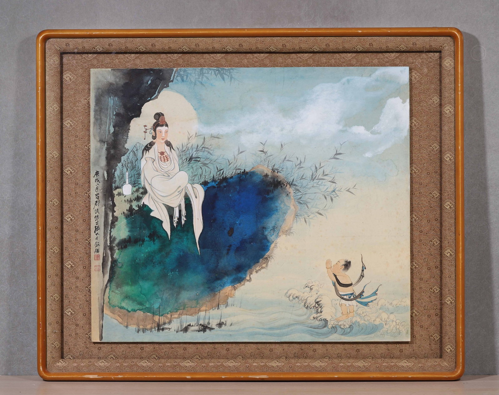 Zhang Daqian,Guanyin With Worshipping Boy,Modern Period,Colour On Paper: Modern figure painting,splash-color rocks,Guanyin seated on rock,boy worshipping amid waves,inscription and seals,fitted in original frame.Frame: L 86cm (33.86 in); W 70cm (27.56 in); Painting: L 64cm