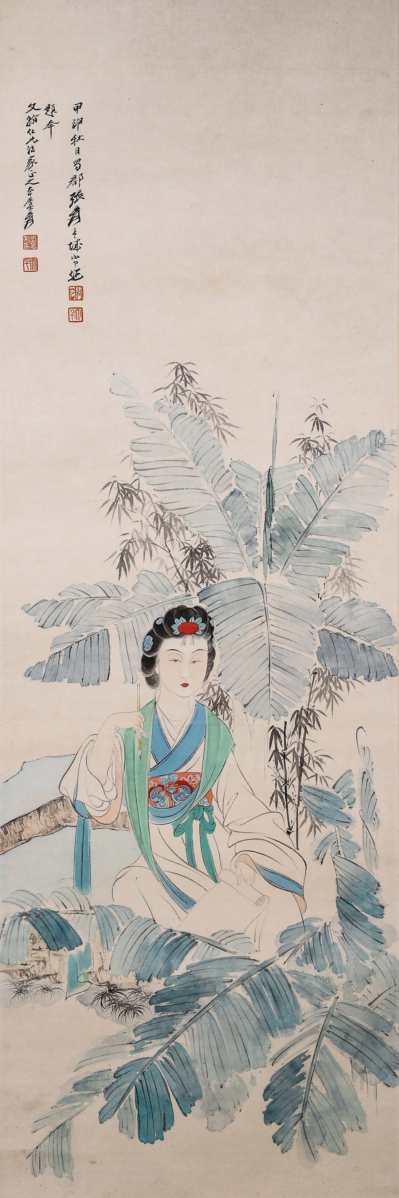 Beauty Under Plantain, Hanging Scroll On Paper, Zhang Daqian: Hanging scroll on paper, ancient-robed lady seated among plantain and bamboos, bright costume colours with gentle facial expression. Inscription upper-left, four seals, original old mounting with
