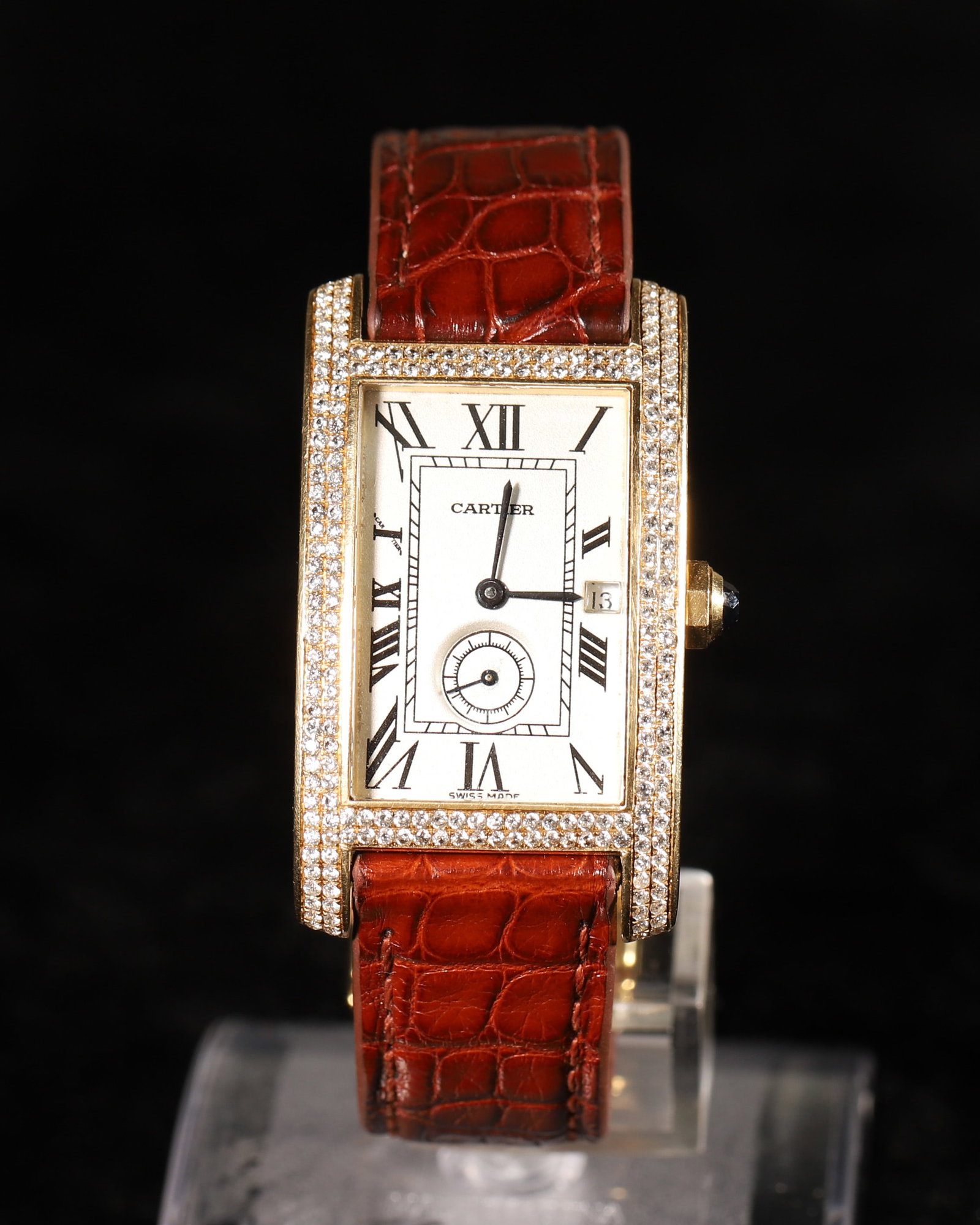 A Cartier Tank Collection 18K Yellow Gold Original Diamond Quartz Wristwatch(In Good Running Order): Iconic Cartier Tank dress watch crafted in solid 18K yellow gold with factory-set original brilliant diamonds around the case. It features a cream dial with classic Roman numerals, subsidiary seconds
