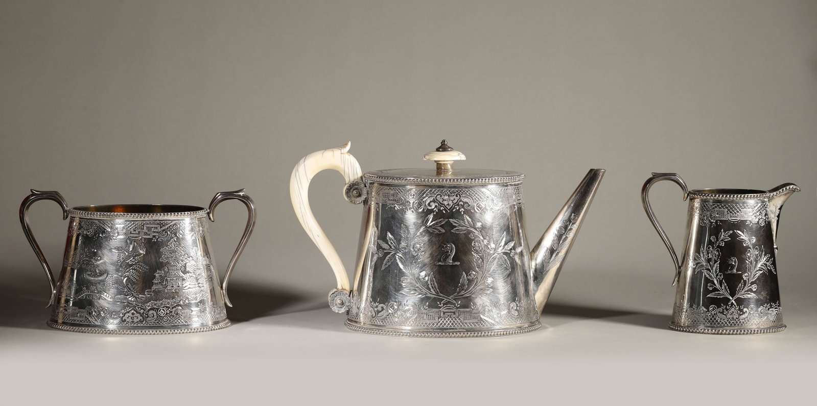 A Charming Victorian Silver Tea Set, Incuding A Tea Pot, A Cream Jar And A Sugar Tank,Dated (1 of 16)