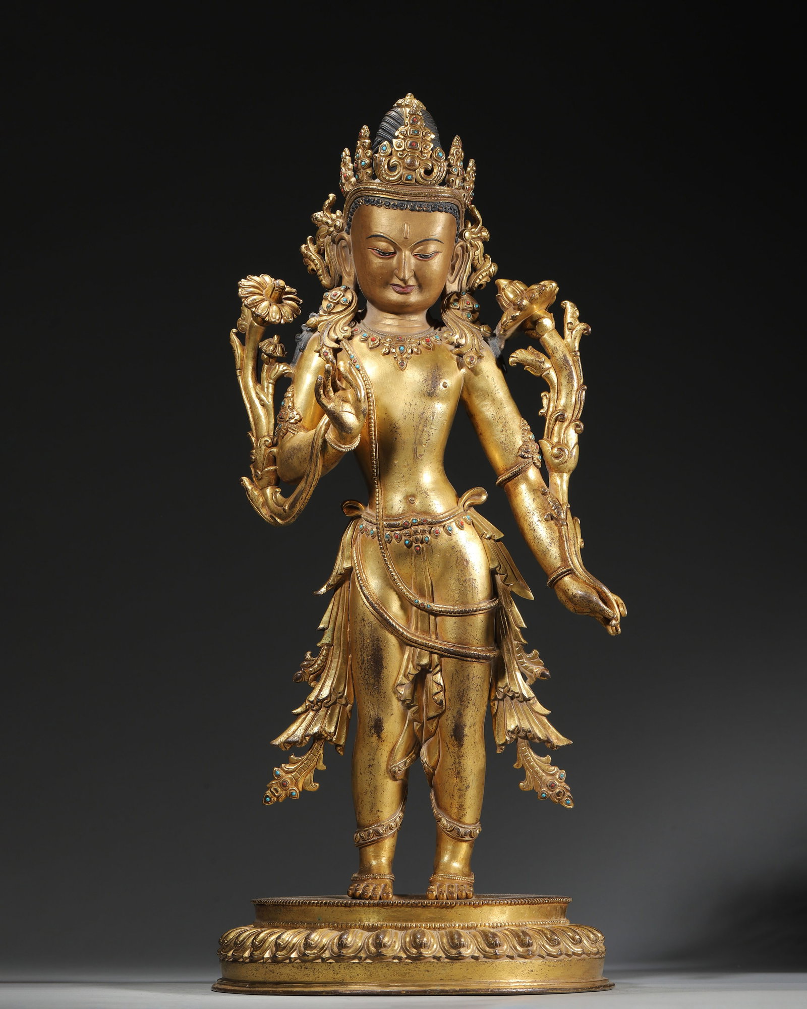 17Th?C18Th Century Gilt-Copper Inlaid Gemstone Statue Of Padmapani: This 17th-18th century Tibetan Buddhist statue depicts Padmapani, cast in gilt copper with gem inlays. It features an elegant tribhanga stance and original sealed base, embodying profound artistic and
