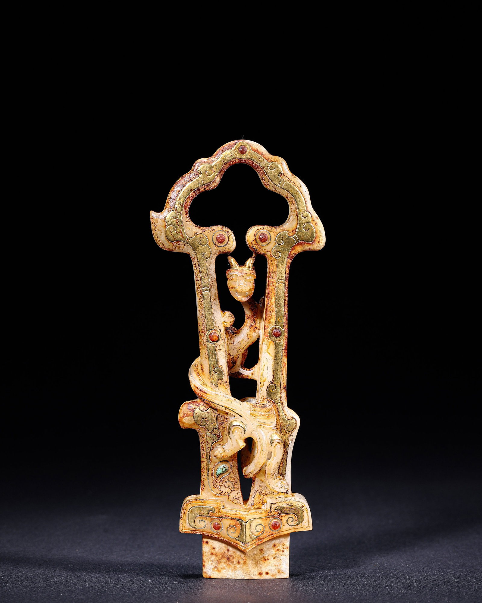 Han-Dynasty Openwork Jade Dragon Ornament, Gold-Wire & Gem Inlay: Han-Dynasty openwork jade ornament with coiled dragon motif, gold-wire and gem inlay, tenon at base for assembly or display, exhibiting aged patina and natural russet inclusions.L6.5cm (2.56 in); H16.