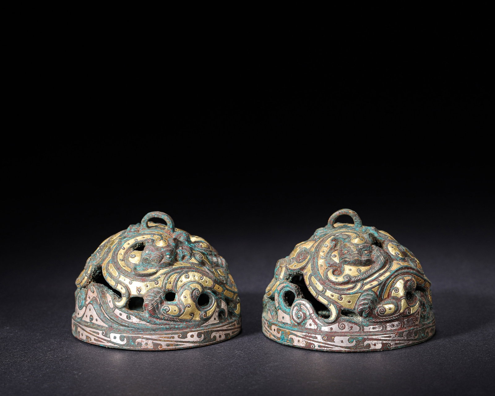 Han-Dynasty Pair Of Openwork Bronze Weight With Gold-Silver Inlay And Mythical-Beast Motif: Pair of Han-Dynasty dome-shaped bronze weights with top suspension loop. Elaborate openwork mythical-beast relief with gold-silver inlay, scroll-cloud border. Flat bases inlaid with interlaced double-