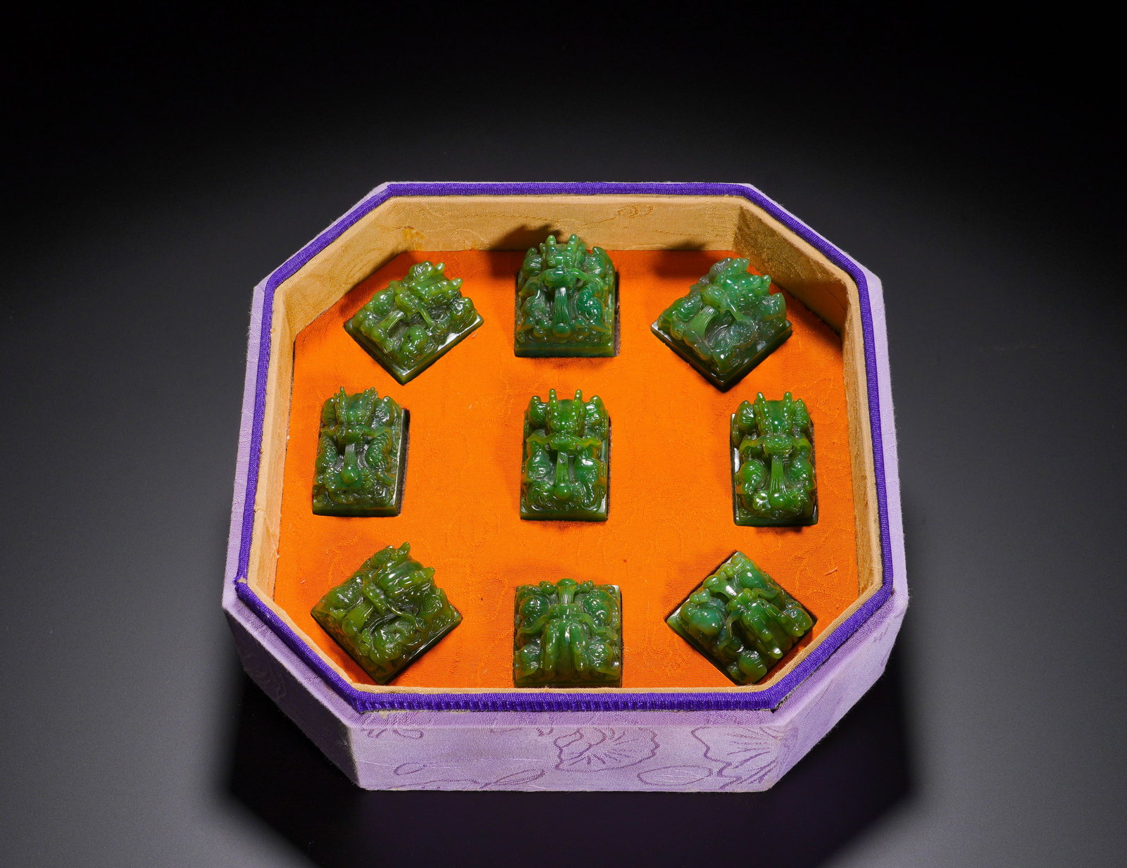 Nine Seals Of Hetian Jade Dragon Knob From The Qing Dynasty: Height:4cm(1.57in), Width:3cm(1.18in), Weight:1240g (2.734lb)Set of Nine Hetian Green Jasper Seals with Upright Dragon Knobs, Original Octagonal Silk BoxThis ensemble of nine seals is carved from prem