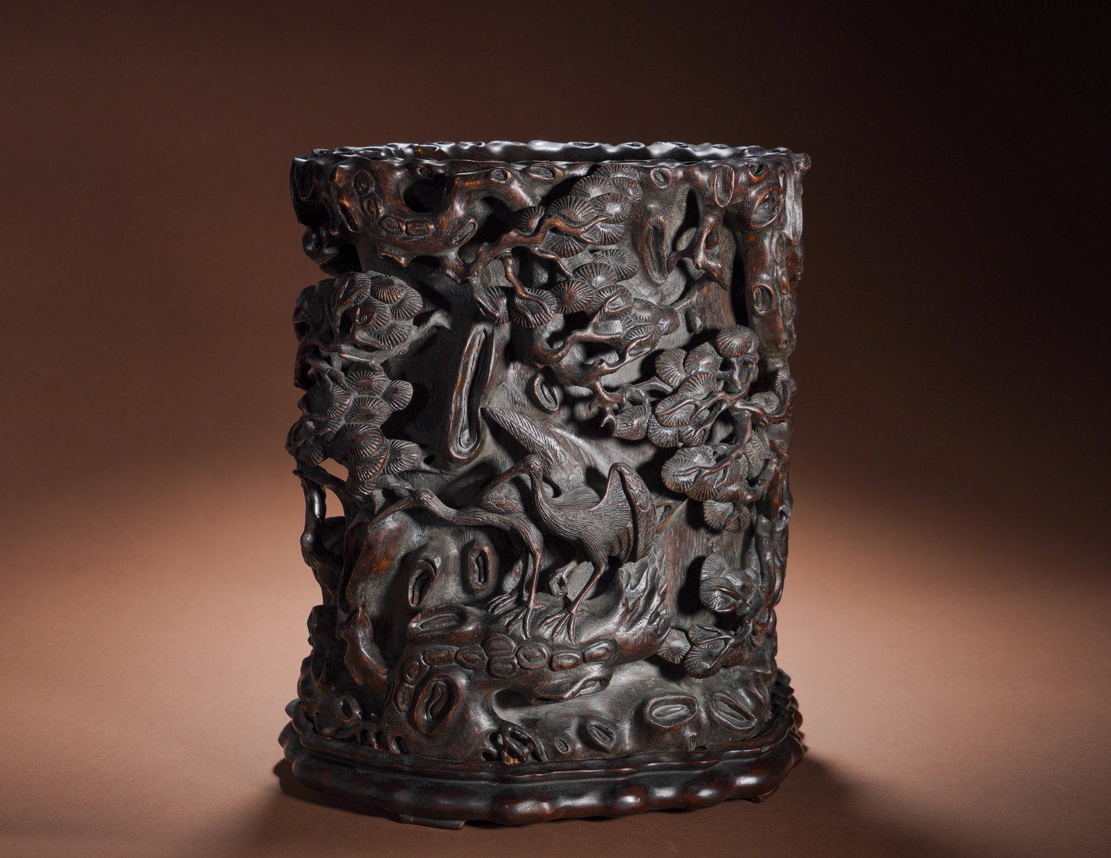 Qing Dynasty Qianlong Agarwood Pine Crane Longevity Hollowed-Out Pen Holder: Height:34cm(13.39in), Width:31cm(12.20in), Weight:3500g (7.716lb)Period: Qianlong reign of Qing Dynasty, inscribed with regular script "Imperial Manufacture of the Qianlong Reign of the Great Qing" on